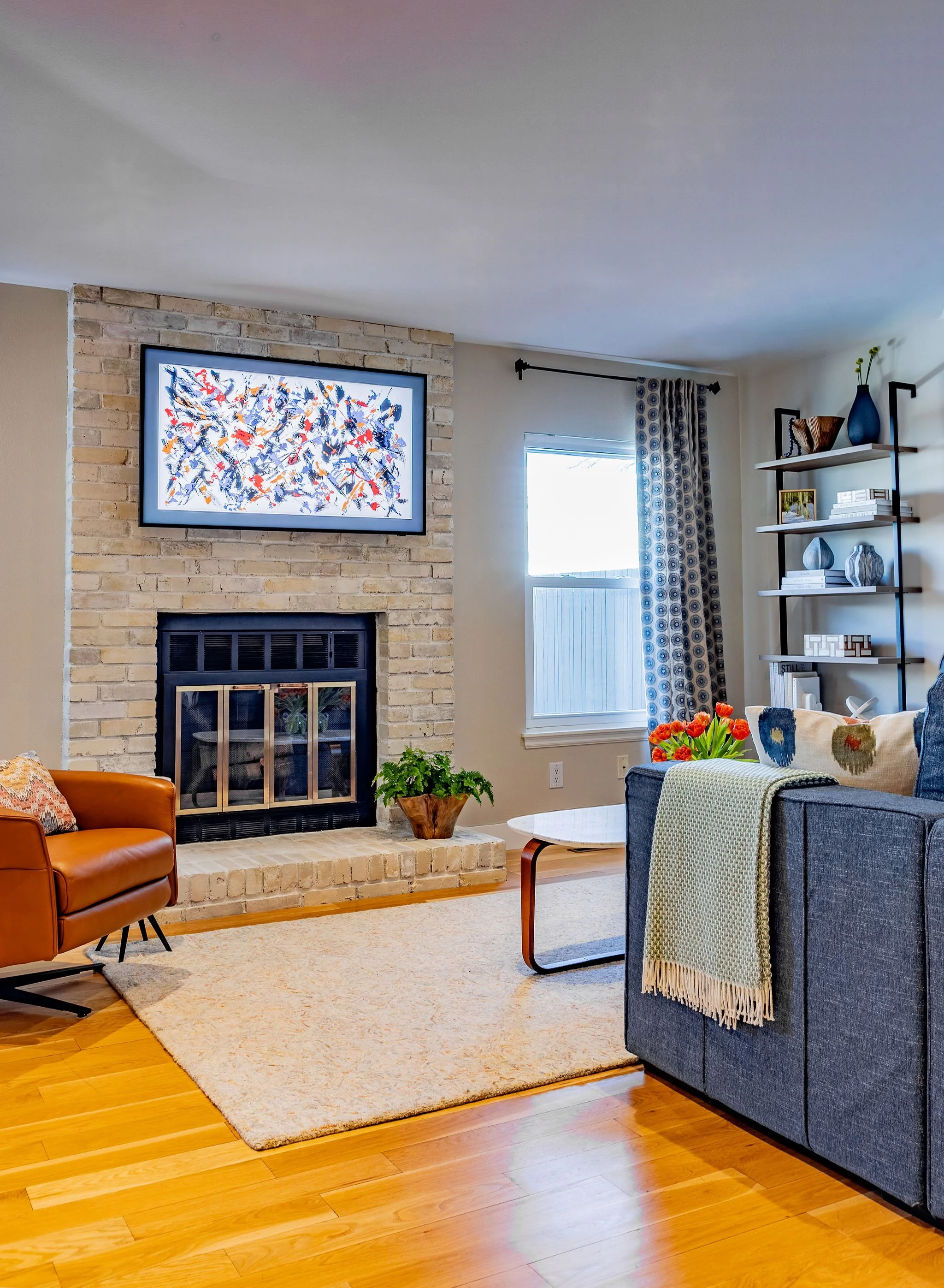 This newly lime-washed fireplace brightens and lightens a room that was previously weighed down by the red, dated brick.