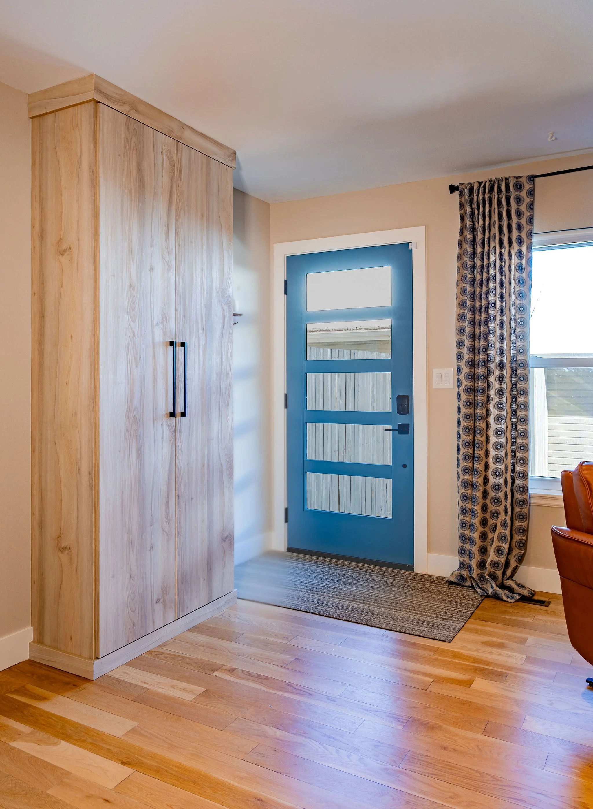 With two busy kids and no dedicated storage in the primary exit/entry this closet provides a place to corral the chaos of shoes and backpacks. Created as a built-in unit, the finish of the cabinet meshes well with the wall color, making it less consp