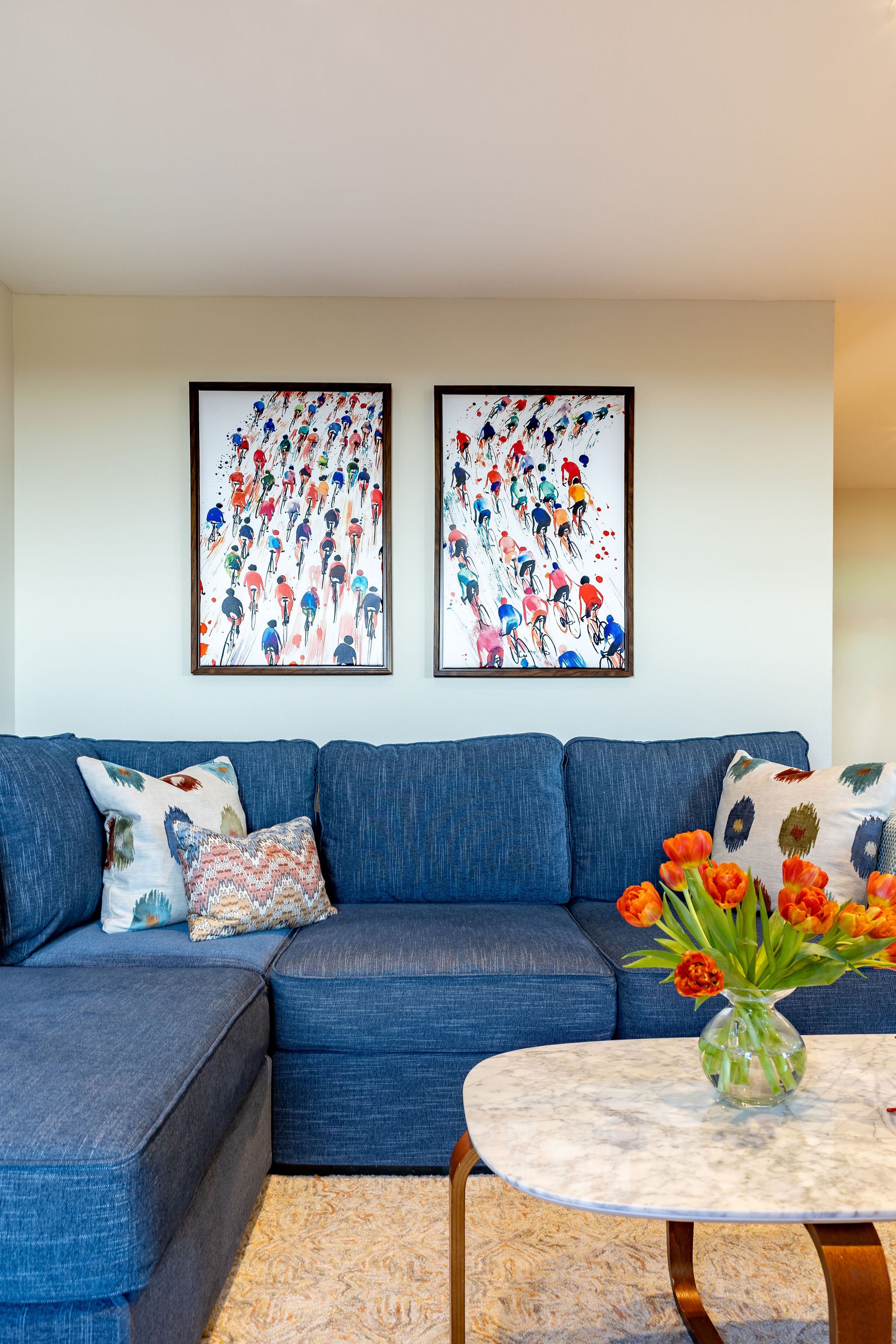 An avid cyclist, the homeowner loves the pop of color provided by the artwork, and echoed in the pillows.