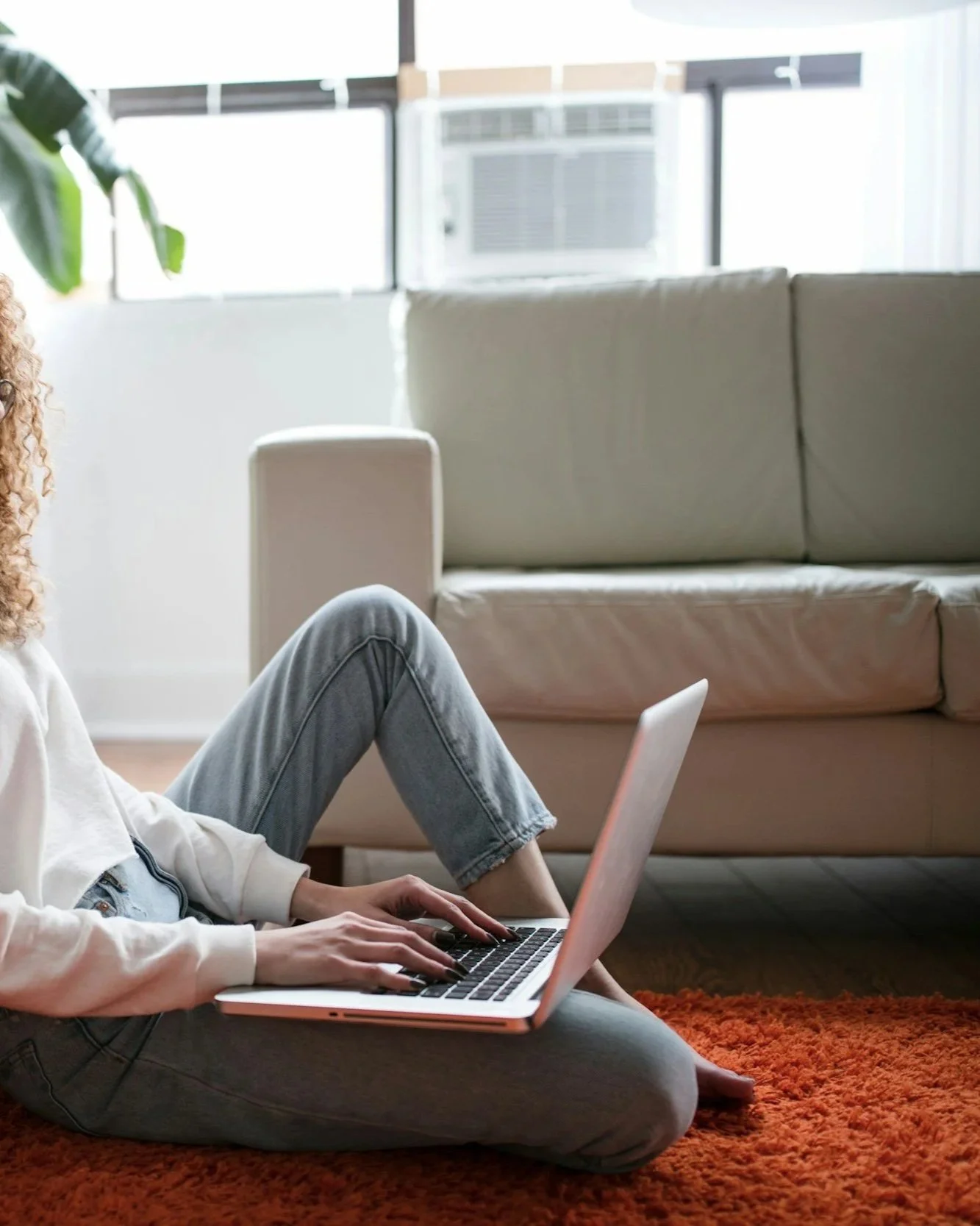 Person using a laptop for online trauma therapy and virtual counseling with a licensed therapist in Iowa.