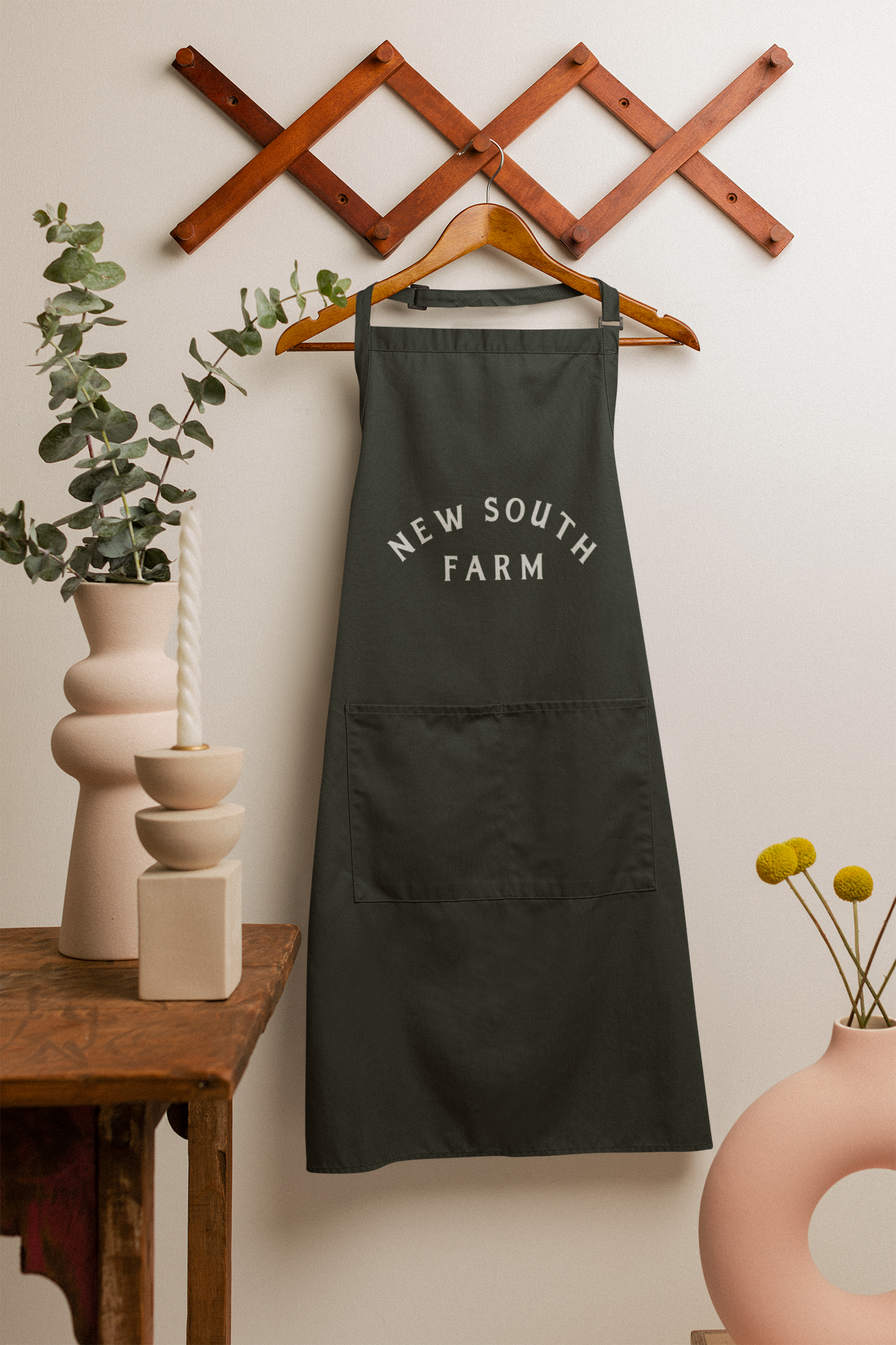 apron-mockup-featuring-modern-ceramic-vases-m23511.png