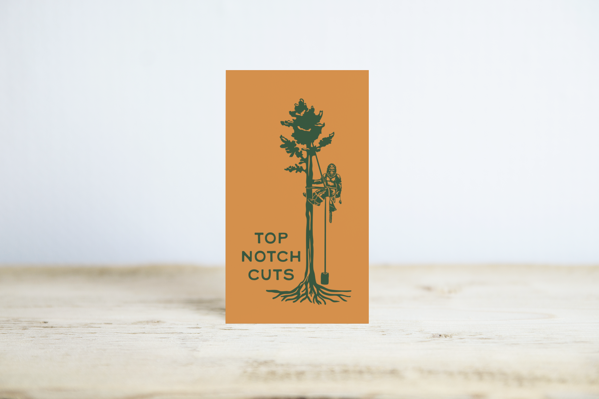 mockup-of-a-vertical-business-card-standing-on-a-wooden-surface-744-el-2.png