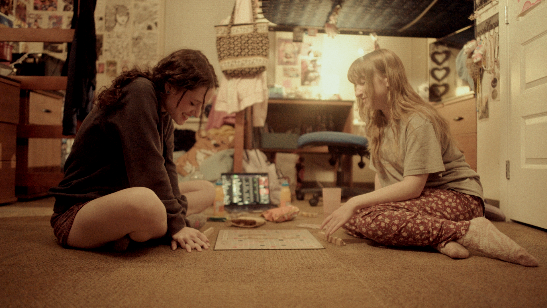 Hyperfixation (2024) – Cinematography by Antoine Jackson Jr, Directed by Ariana Hall. In Photo is Claire Ellis as Lana Carter & Syd Jarczaszek as Bela Carter, Playing scrabble.
