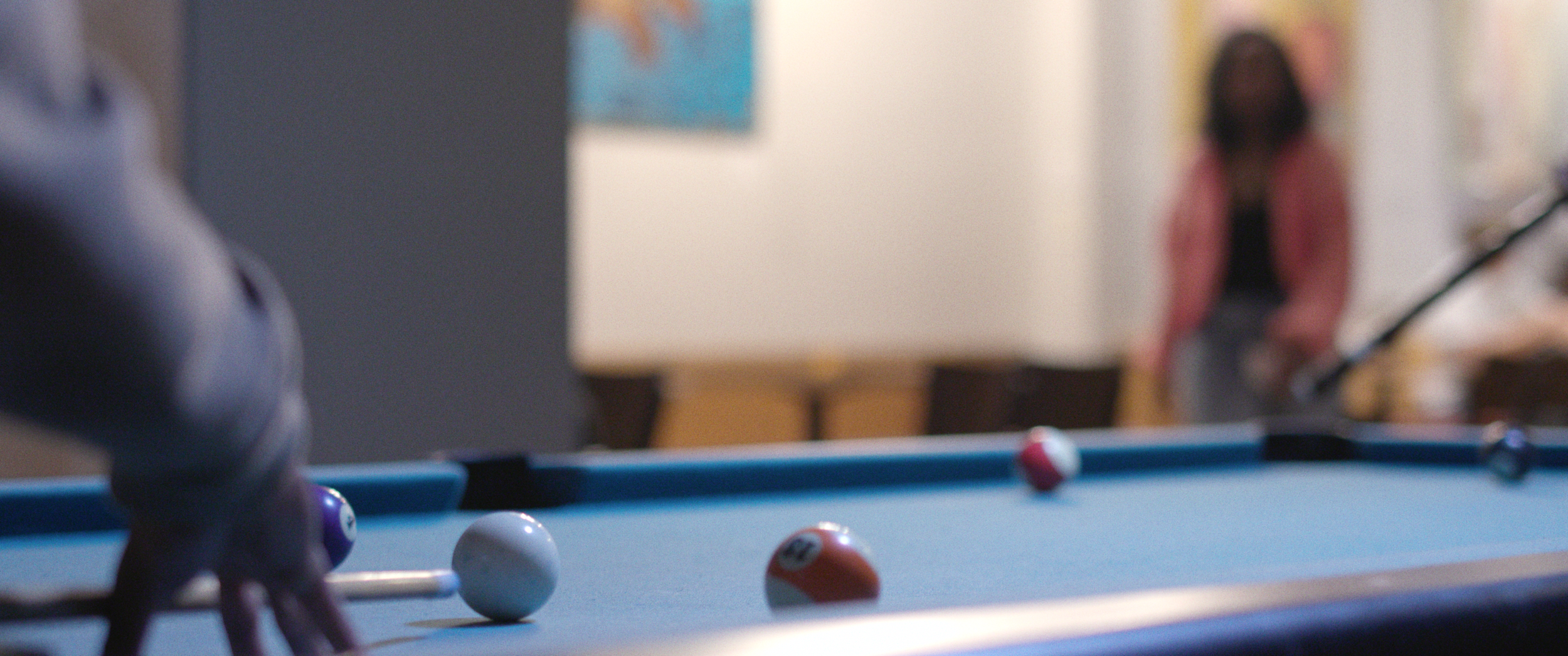 HEARD (2025) – Cinematography by Antoine Jackson Jr, Directed by Kareem Callaway. In Photo is Maya Simone as Sabrina, walking to pool table.