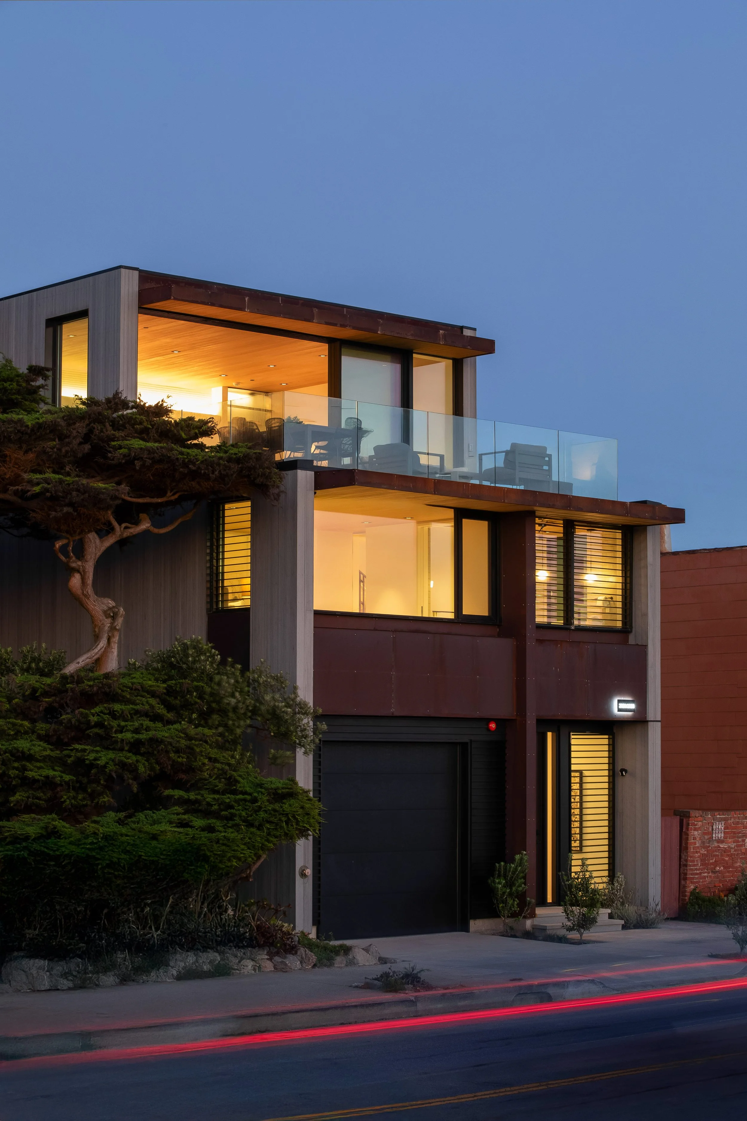 Exterior shot of this modern home. The Cold Rolled steel exhibits the natural beauty of the rust coloring the metal panels.