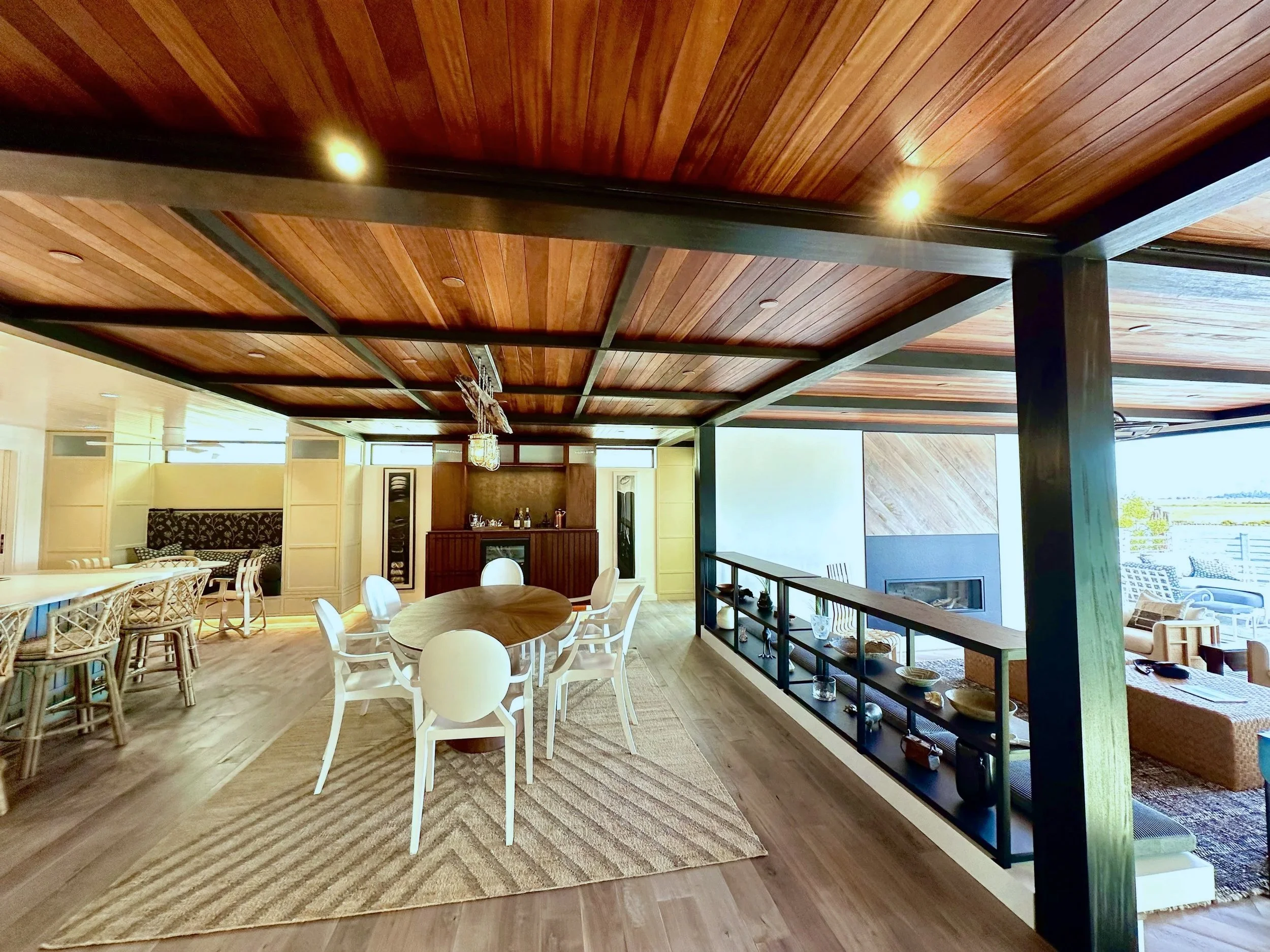 Luxurious Bel Marin dining area with African Mahogany ceiling finished with hand-rubbed luxurious Rubio Monocoat by Bay Area painting company Chroma Colors.