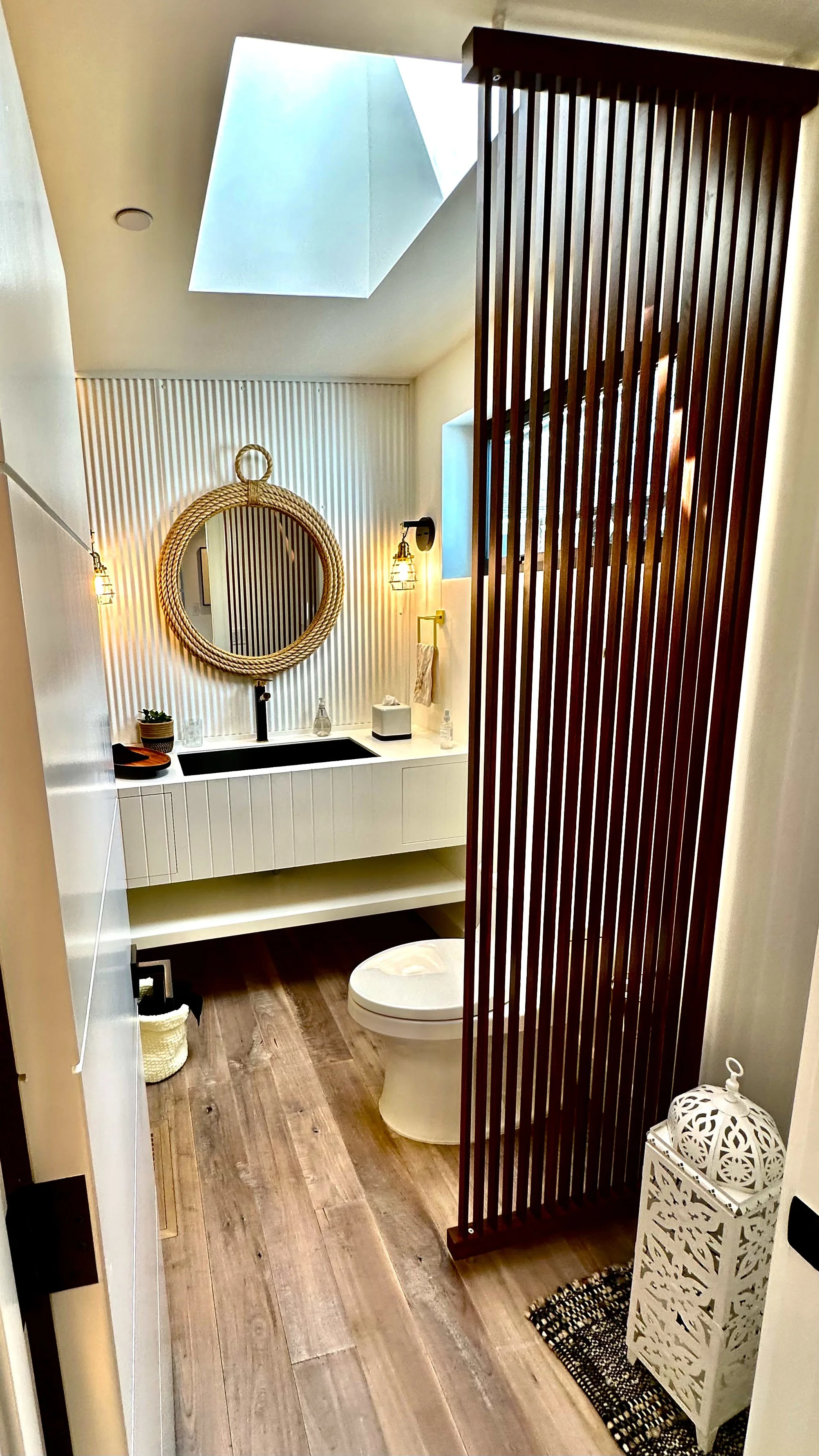 Luxurious Bel Marin powder room with African Mahogany detailing finished with hand-rubbed luxurious Rubio Monocoat by Bay Area painting company Chroma Colors.