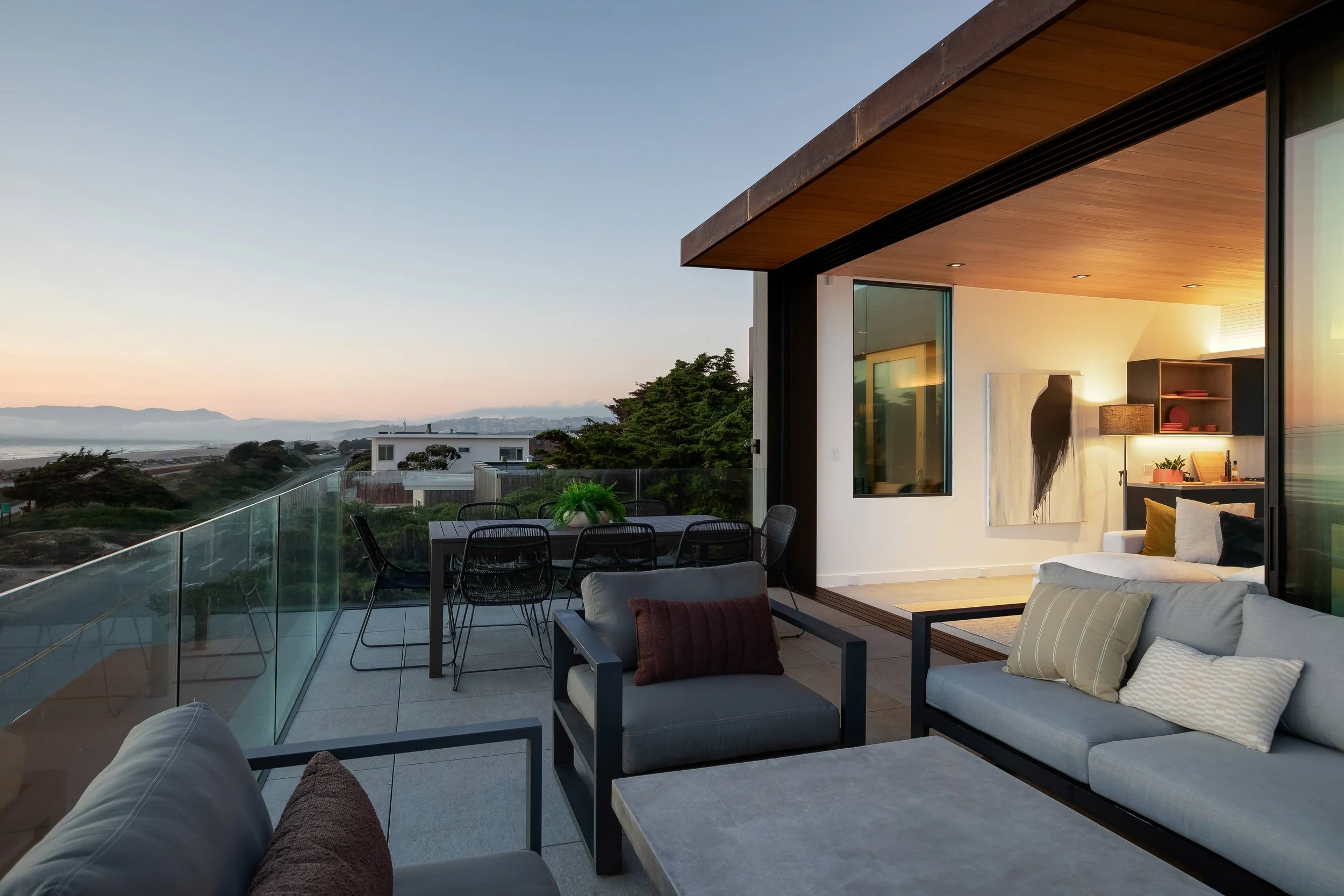 This open deck and large siding doors create a living space that includes ocean front living, with a luxurious, well appointed interior that blends perfectly with the exterior.