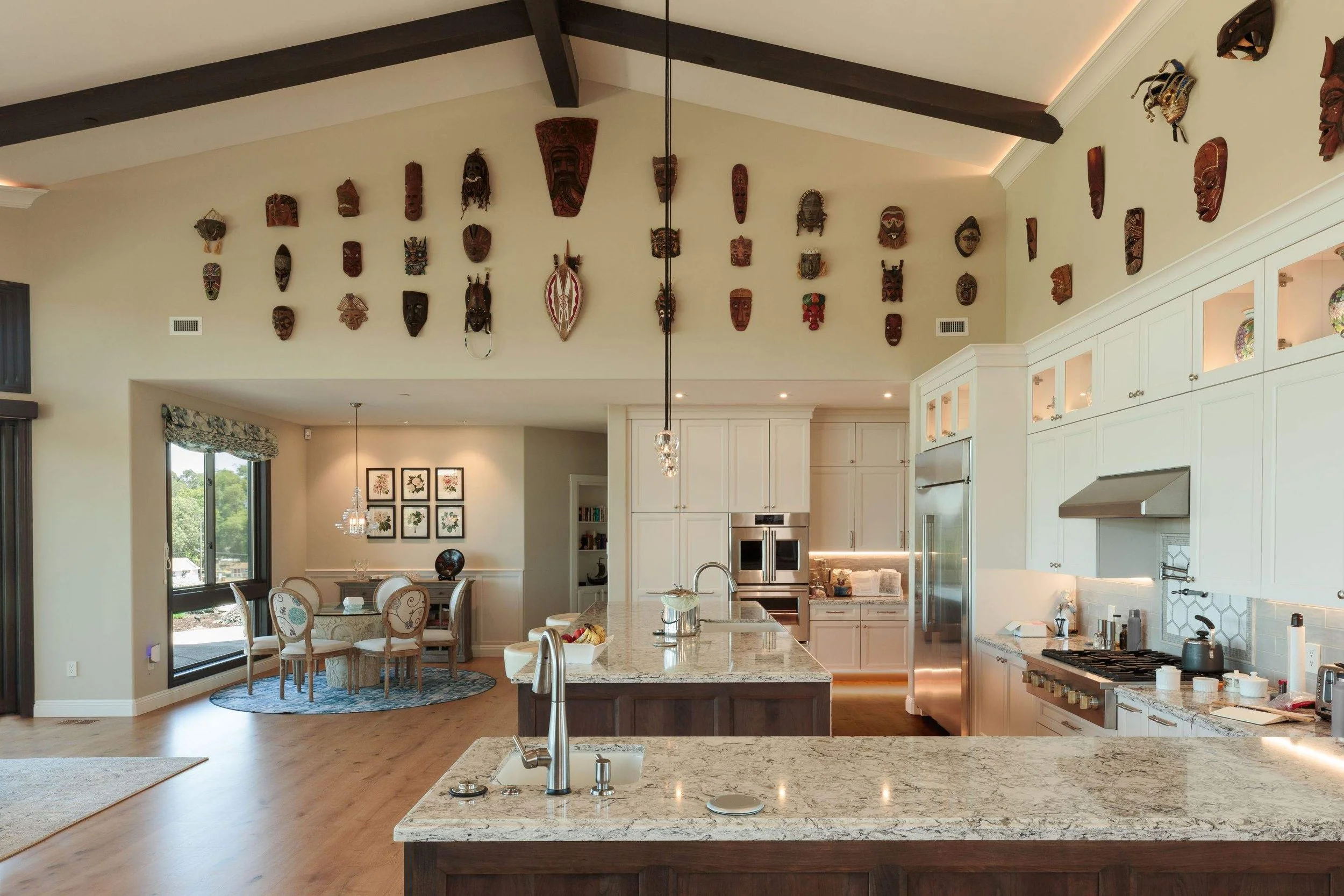 Great room and kitchen of luxurious new construction vineyard estate with custom cabinetry and painting finished by Bay Area luxury painting company Chroma Colors.