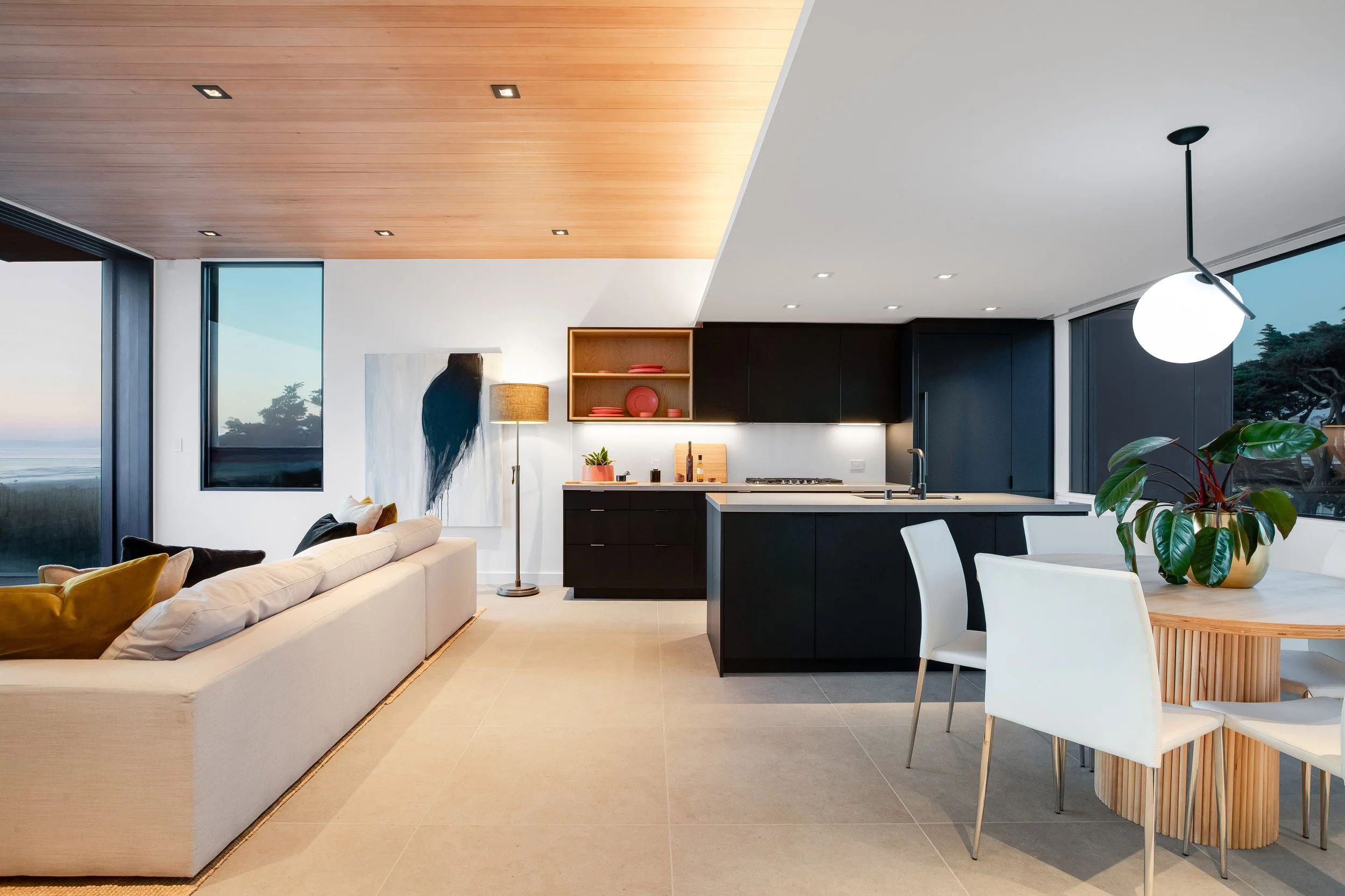 Stained wood ceilings, white painted soffit, modern kitchen.