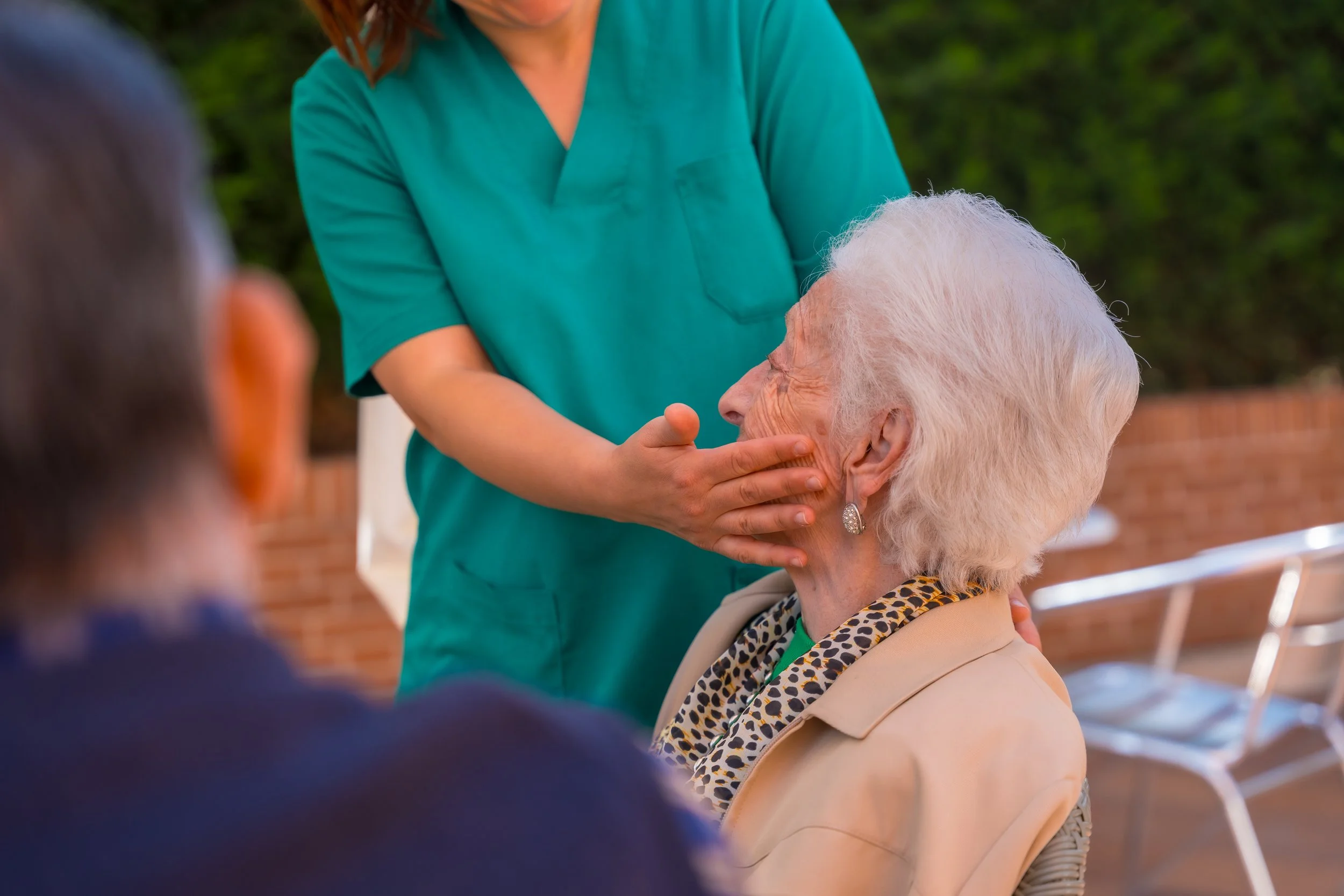 an-older-or-mature-woman-with-the-nurse-in-the-gar-2024-12-09-01-52-57-utc.jpg