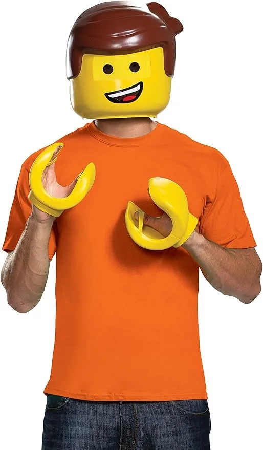 Person wearing a yellow LEGO head mask with a smiling face, an orange t-shirt, and holding large yellow LEGO hand accessories.