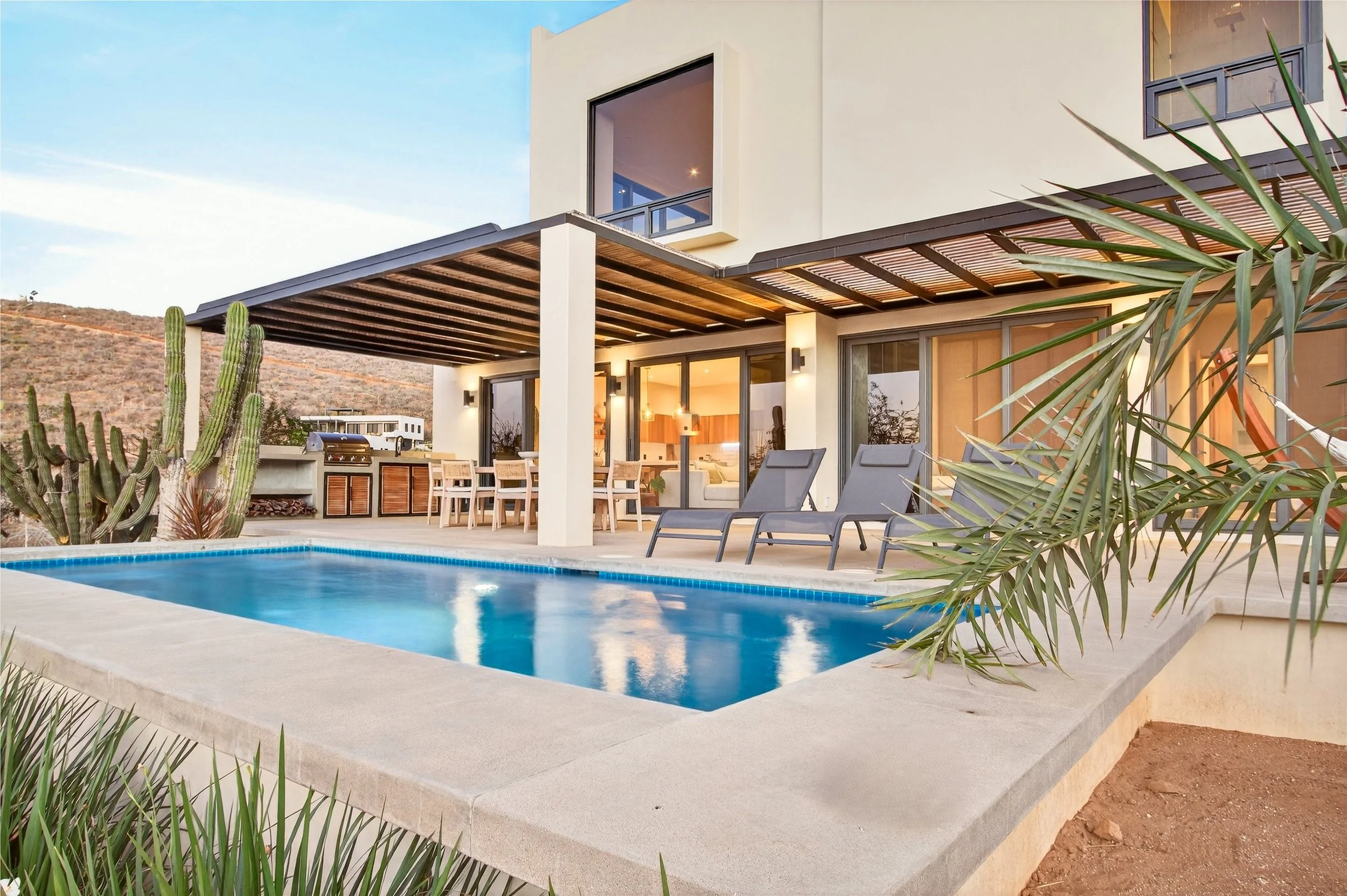 Exterior view of Villa 1 within a gated Pescadero Beach compound, featuring classic Baja architecture and a private, tranquil setting.