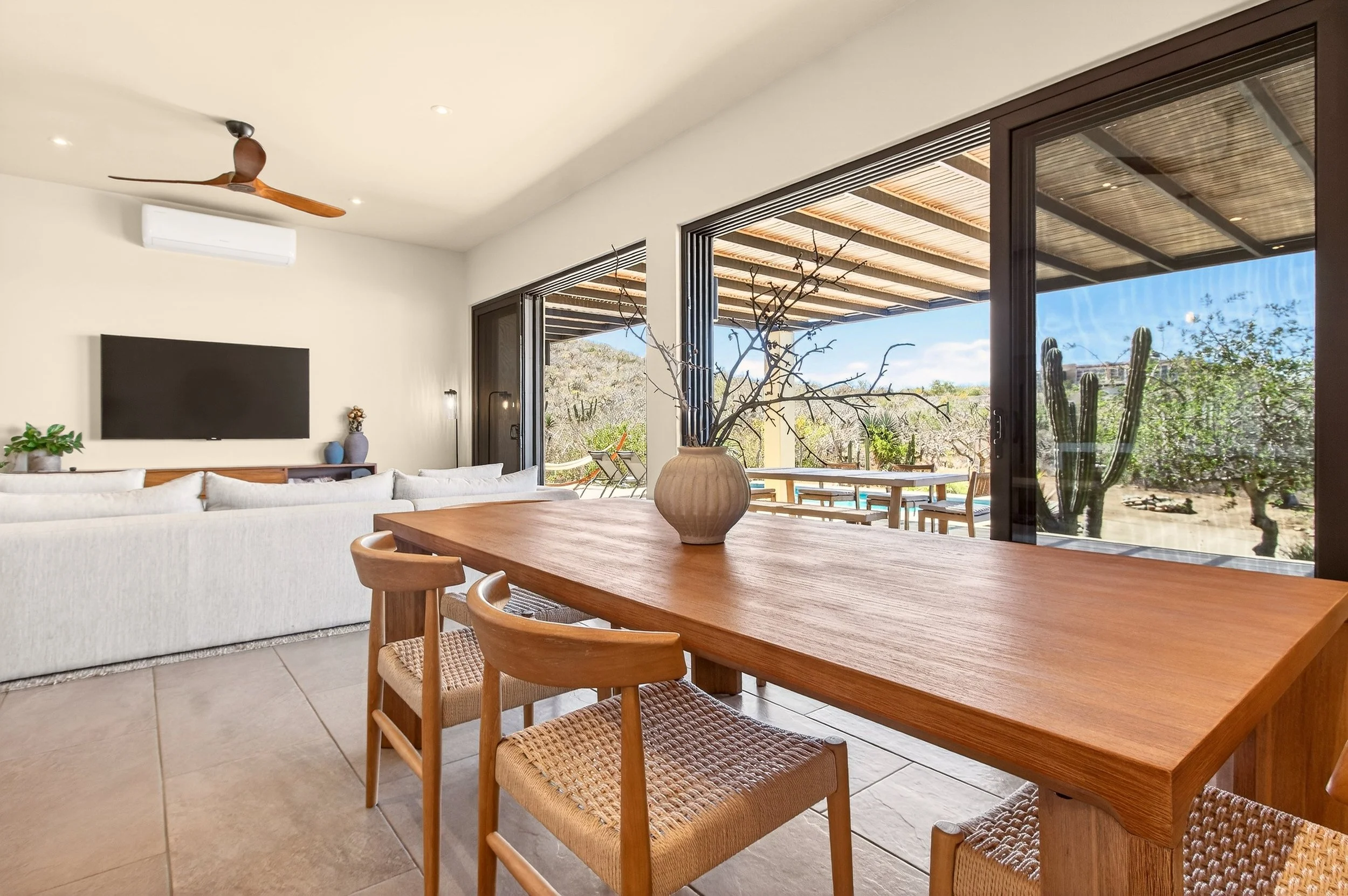 Indoor-outdoor living space at Villa Pacifica with sliding glass doors