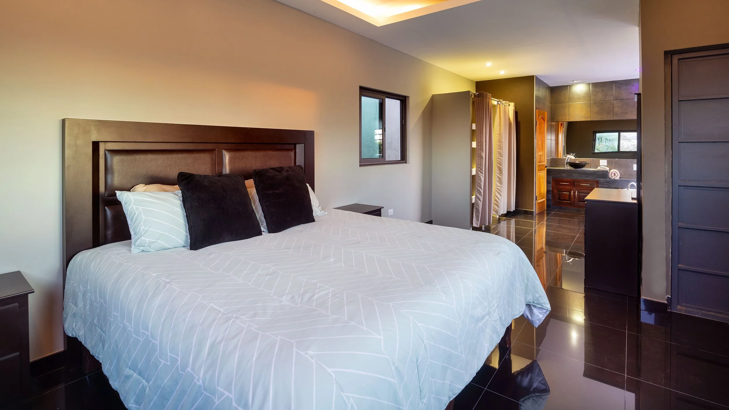 Second-floor primary suite with ocean views in Villa 1 near Pescadero Beach.