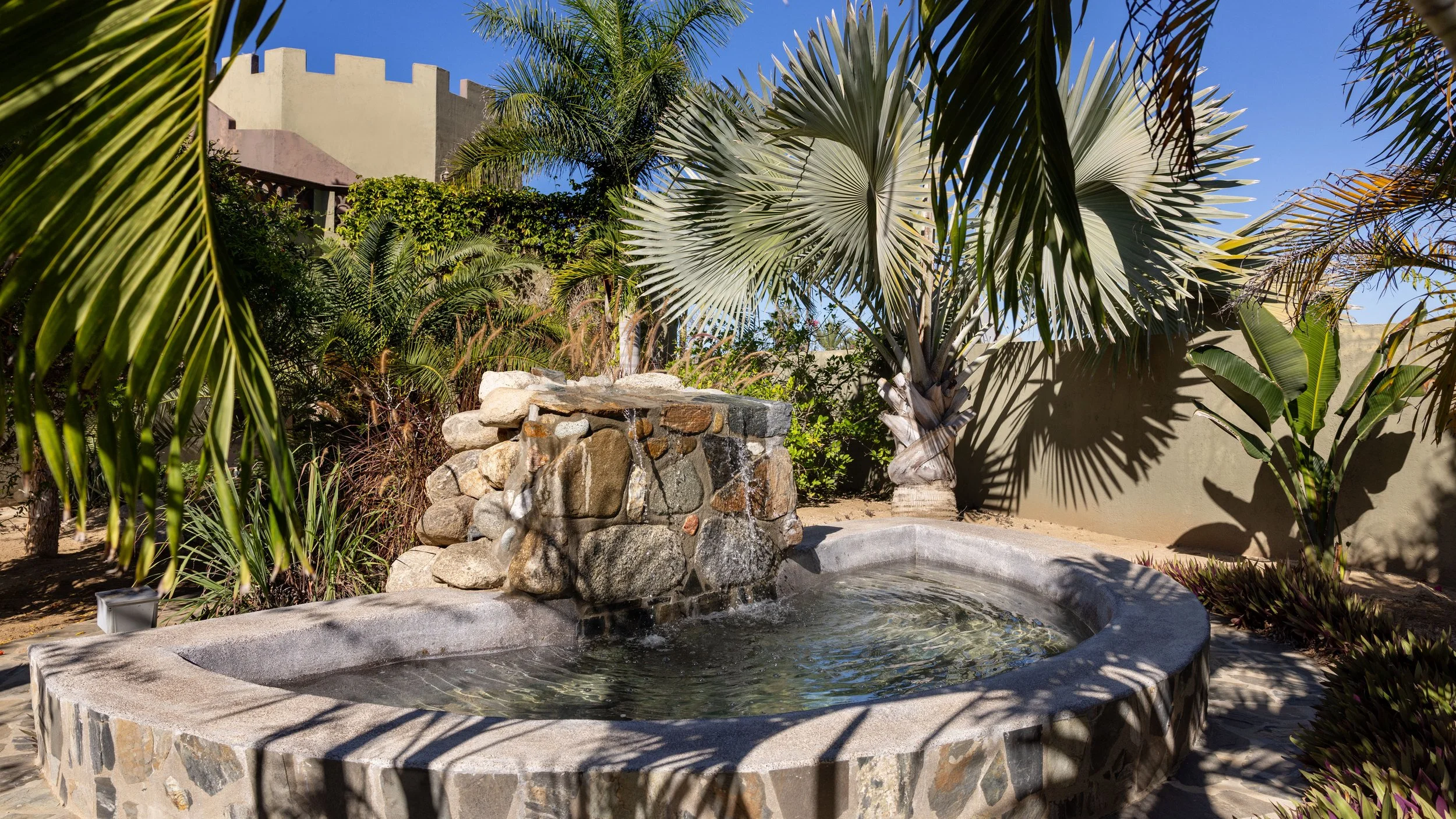Private outdoor hot tub in a gated Pescadero family compound.