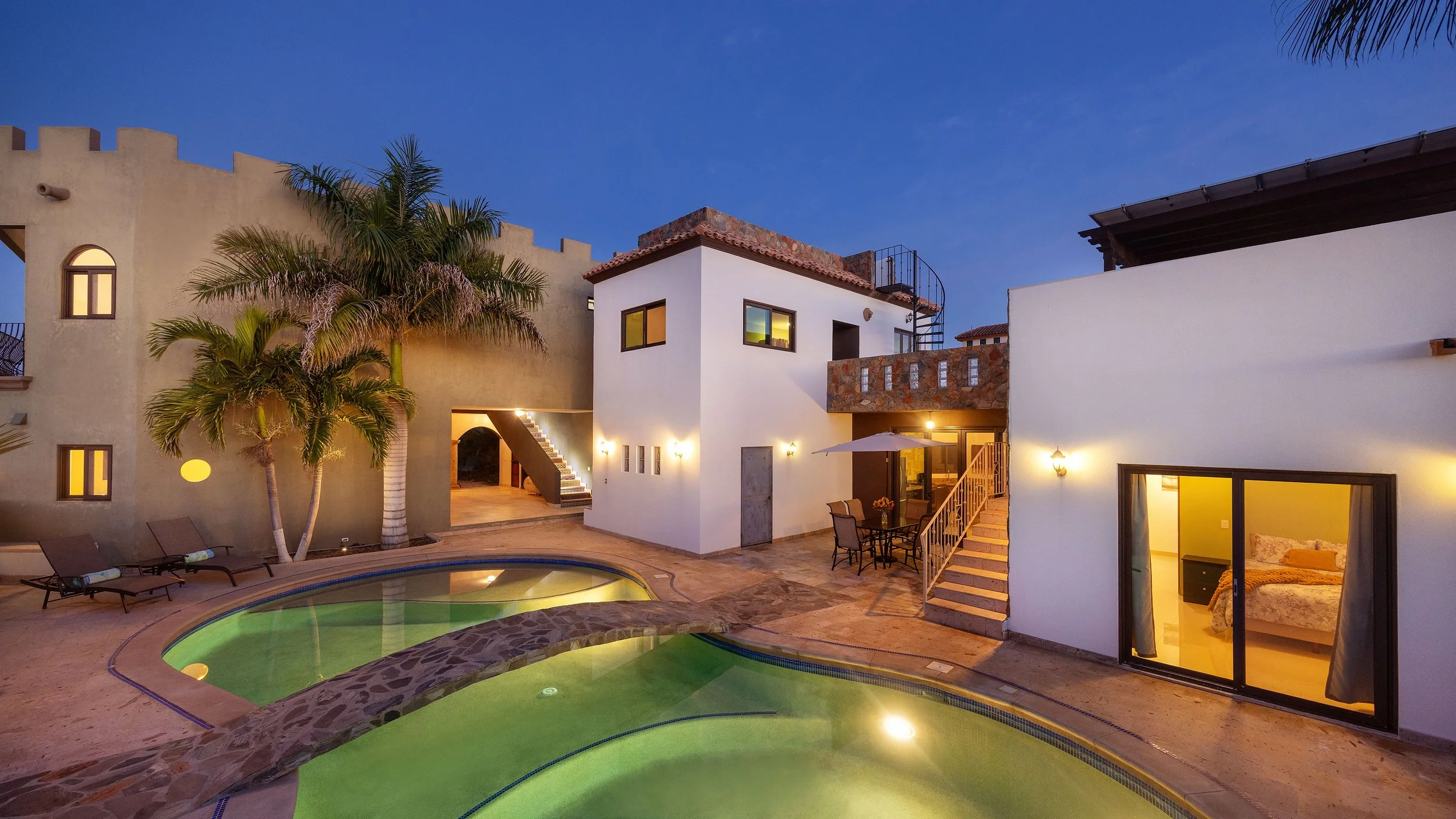 Exterior view of Villa 1 within a gated Pescadero Beach compound, featuring classic Baja architecture and a private, tranquil setting.