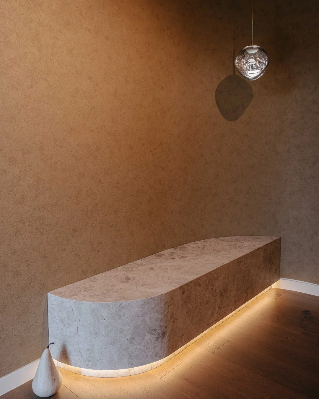 As soon as you step into our Lane Cove project, you're met with a stunning curved bench detail, illuminated by soft LED strip lighting, and a custom-built hallway niche that creates a seamless, considered entry. Every element in this home has been bu