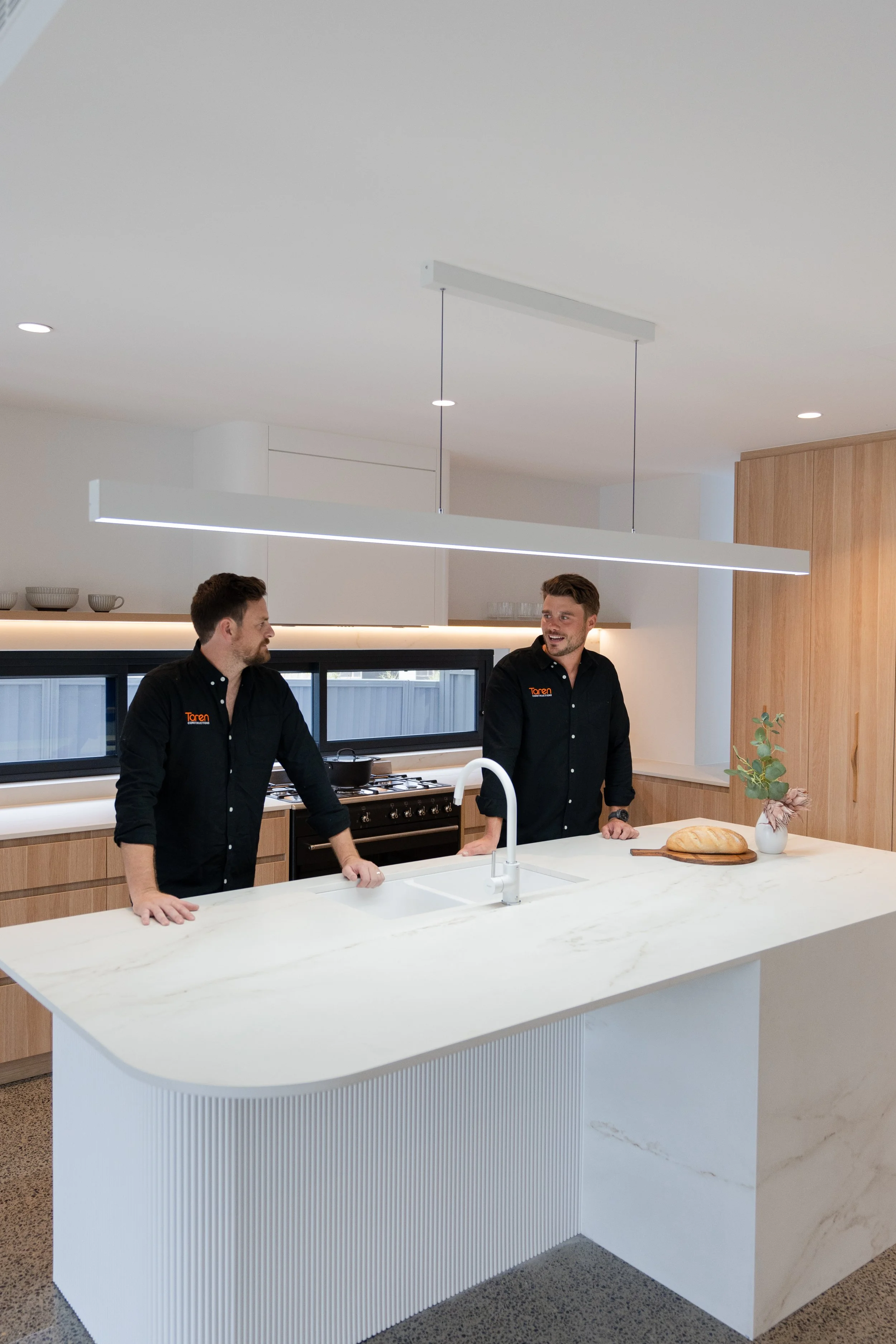 Directors Jake and Tristan in custom-made kitchen in Sydney home