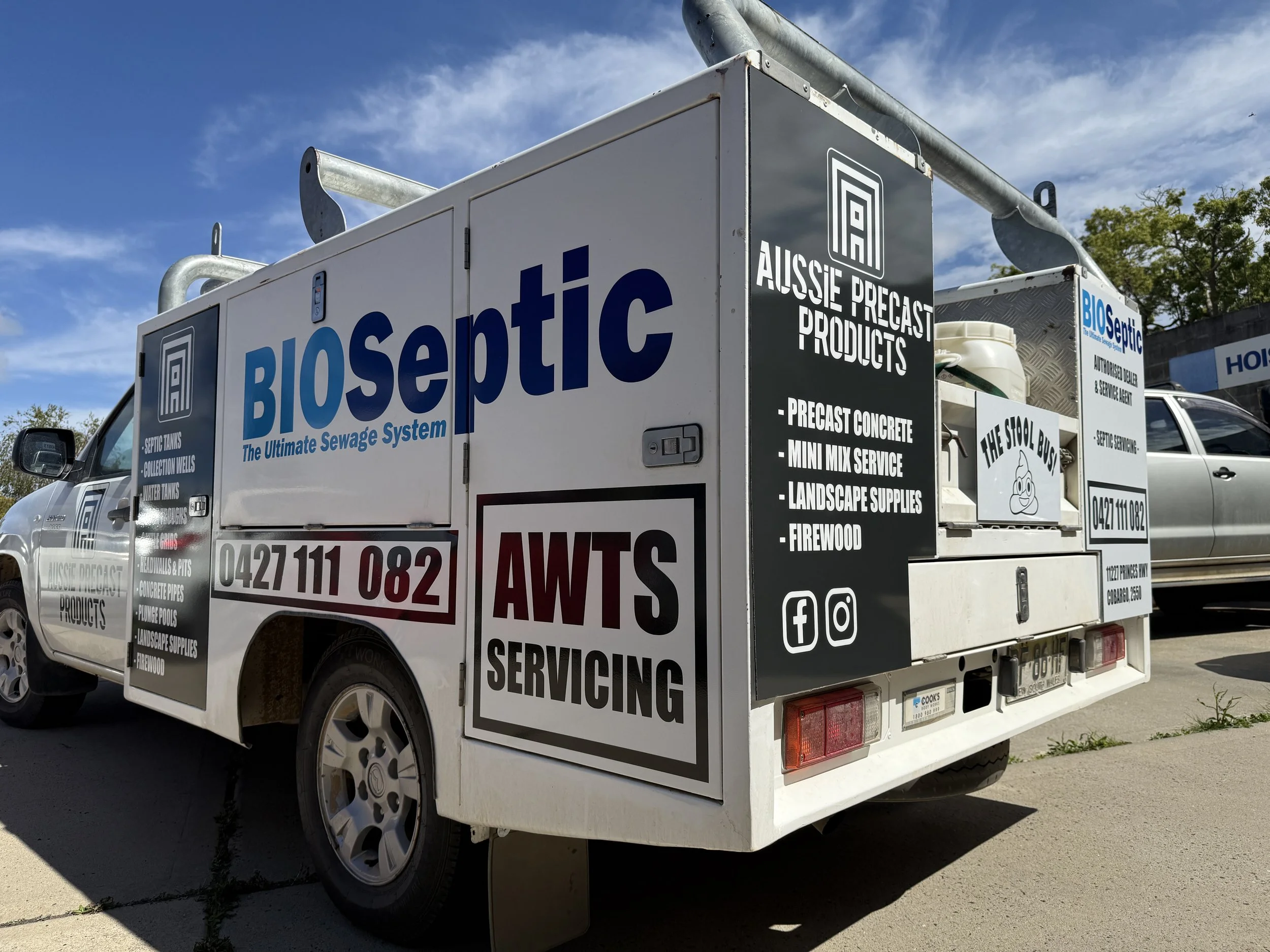 A service truck with apart wrapped and cut vinyl sign writing.