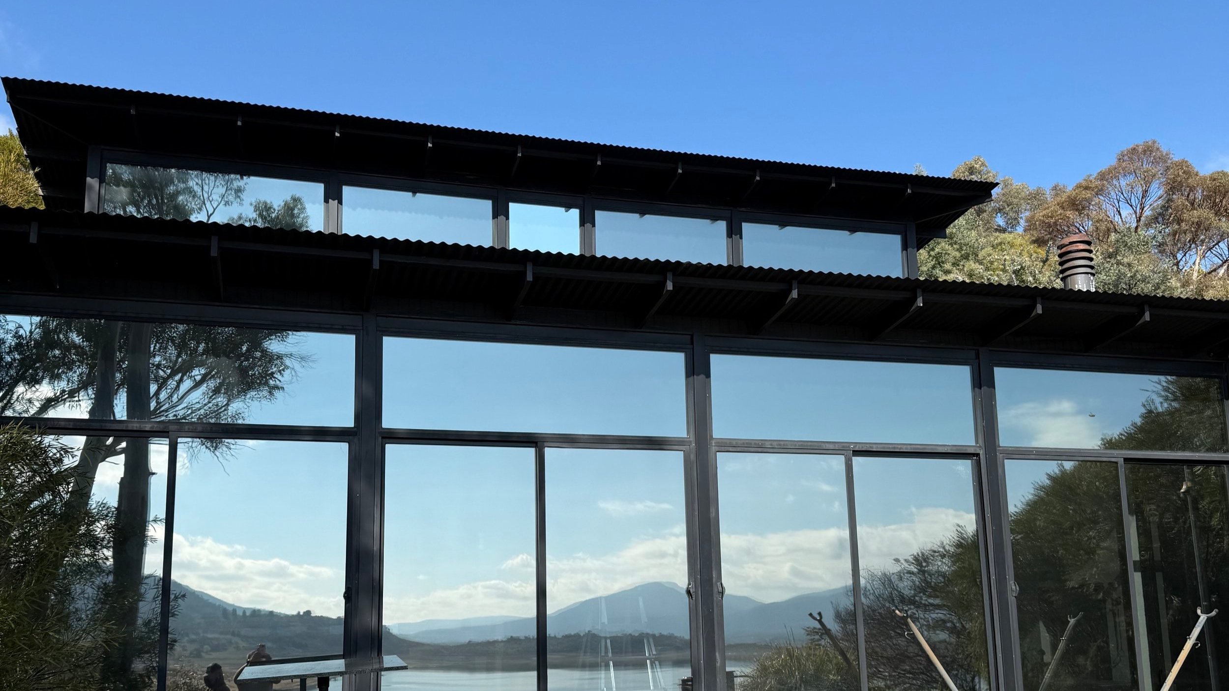 Modern glass building with large tinted windows