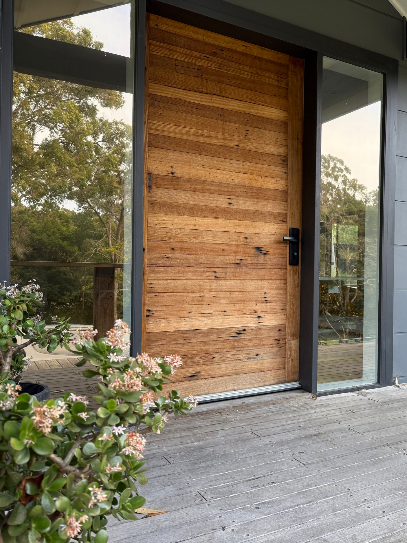 Modern house window tinting, timber front door, insulation window film.
