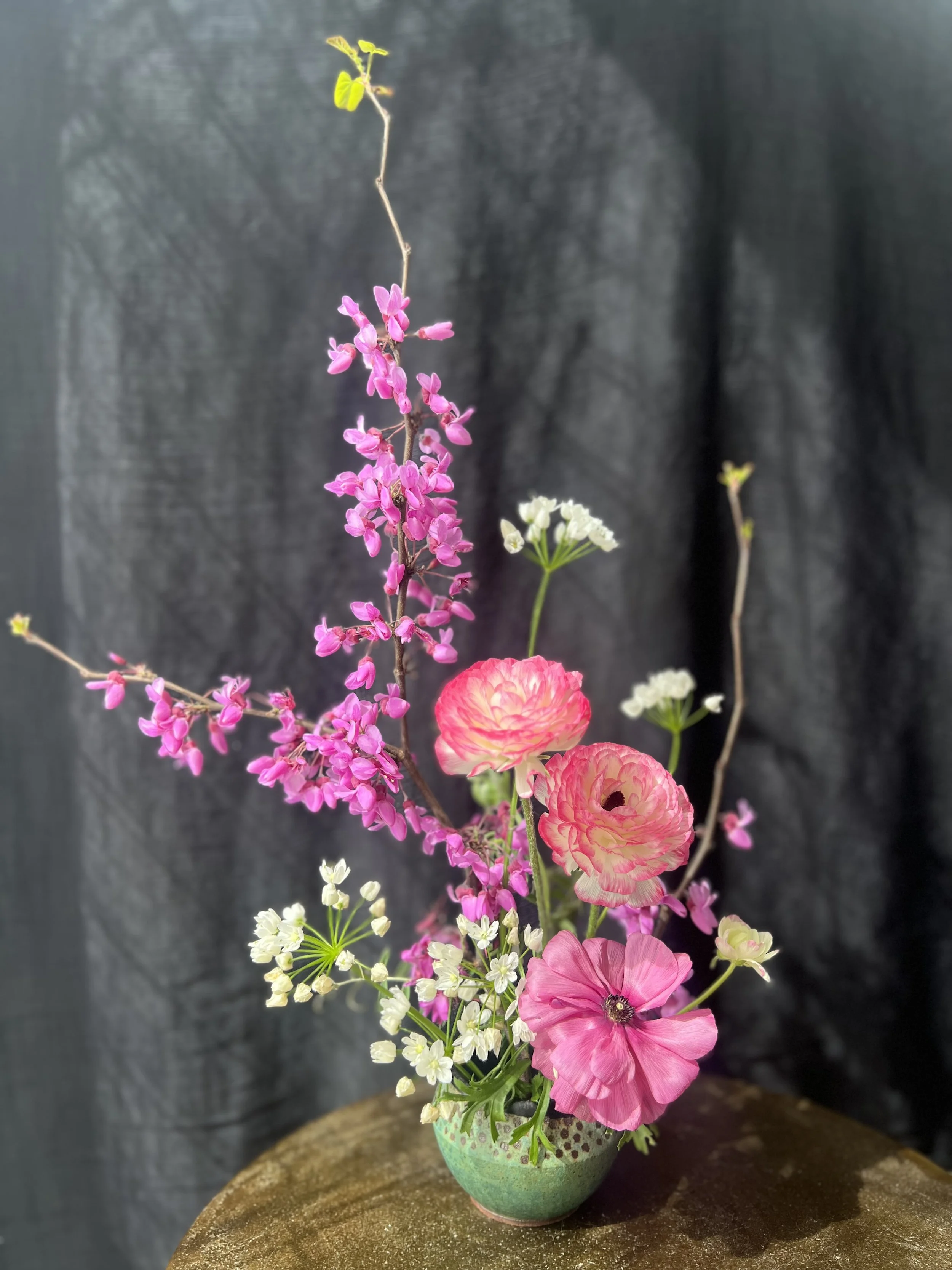 Floral arrangment in a hand made ceramic vase.