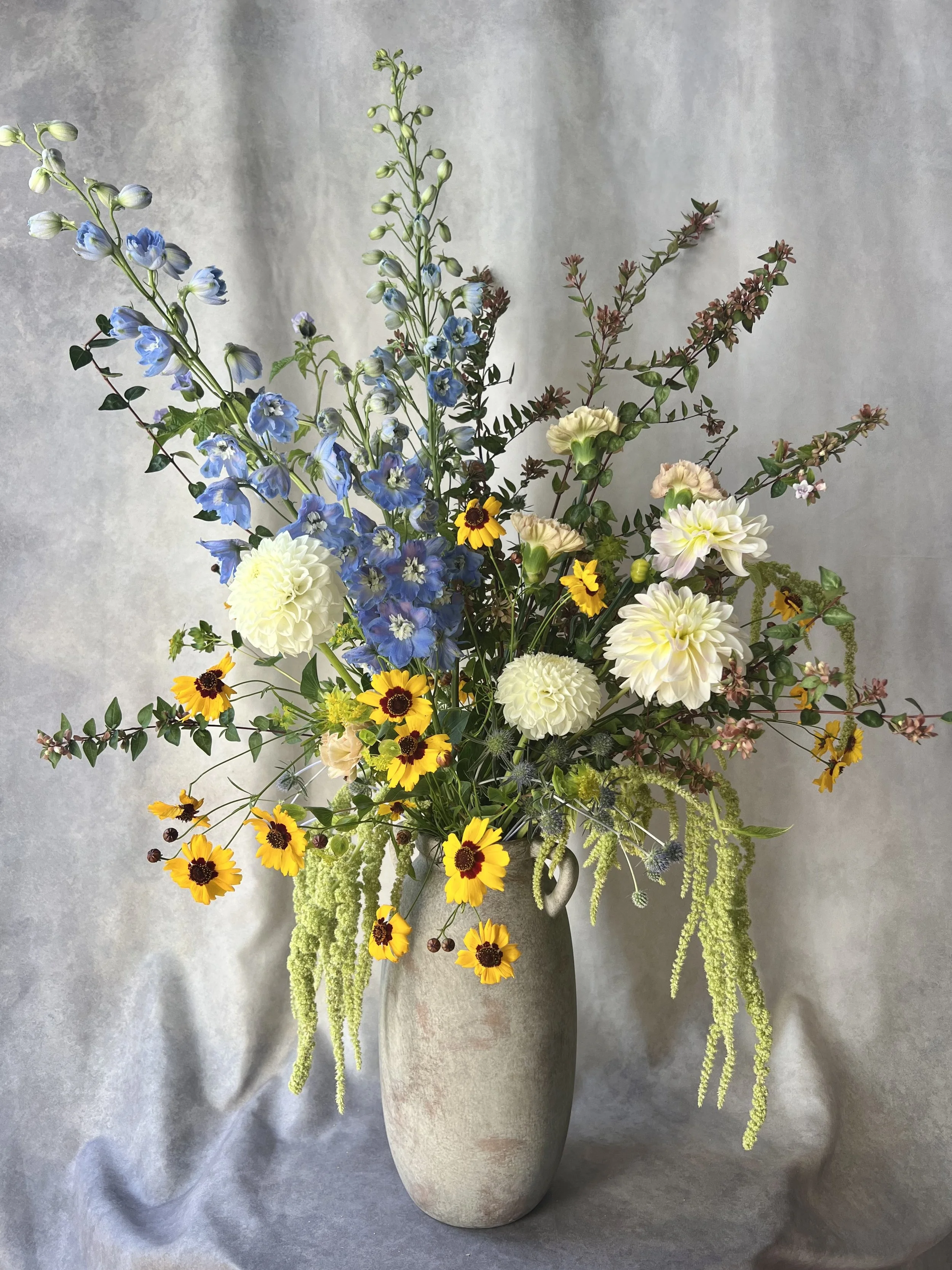Soft blue and yellow tall arrangement.