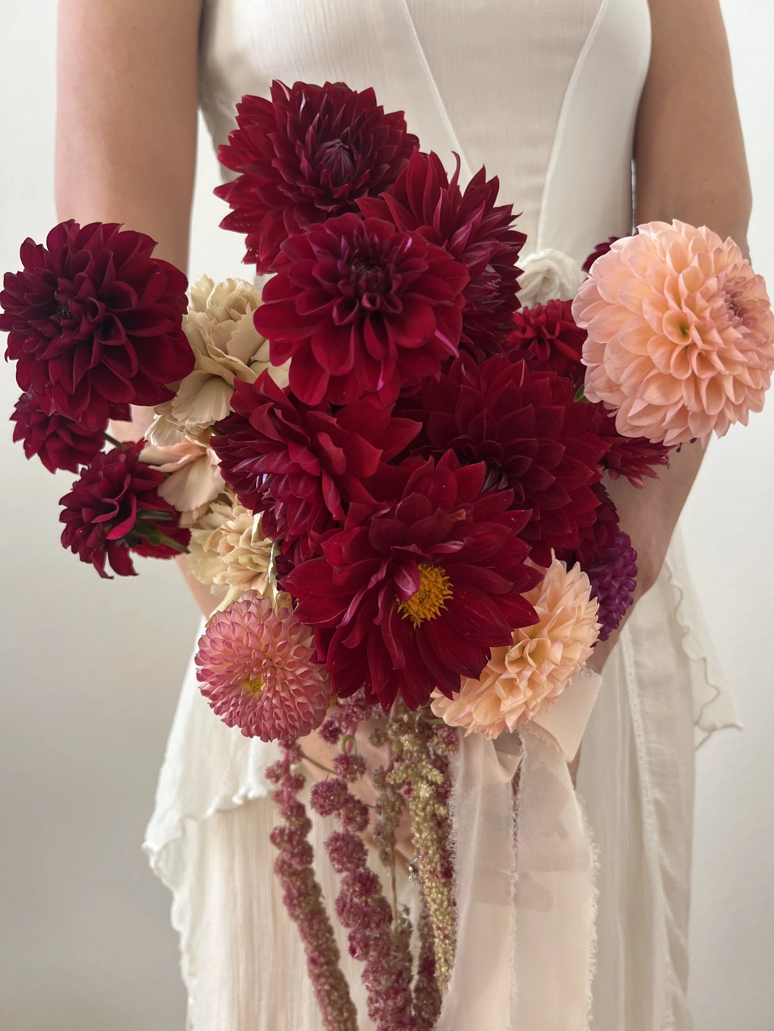 Dramatic, burgundy bridal bouquet.