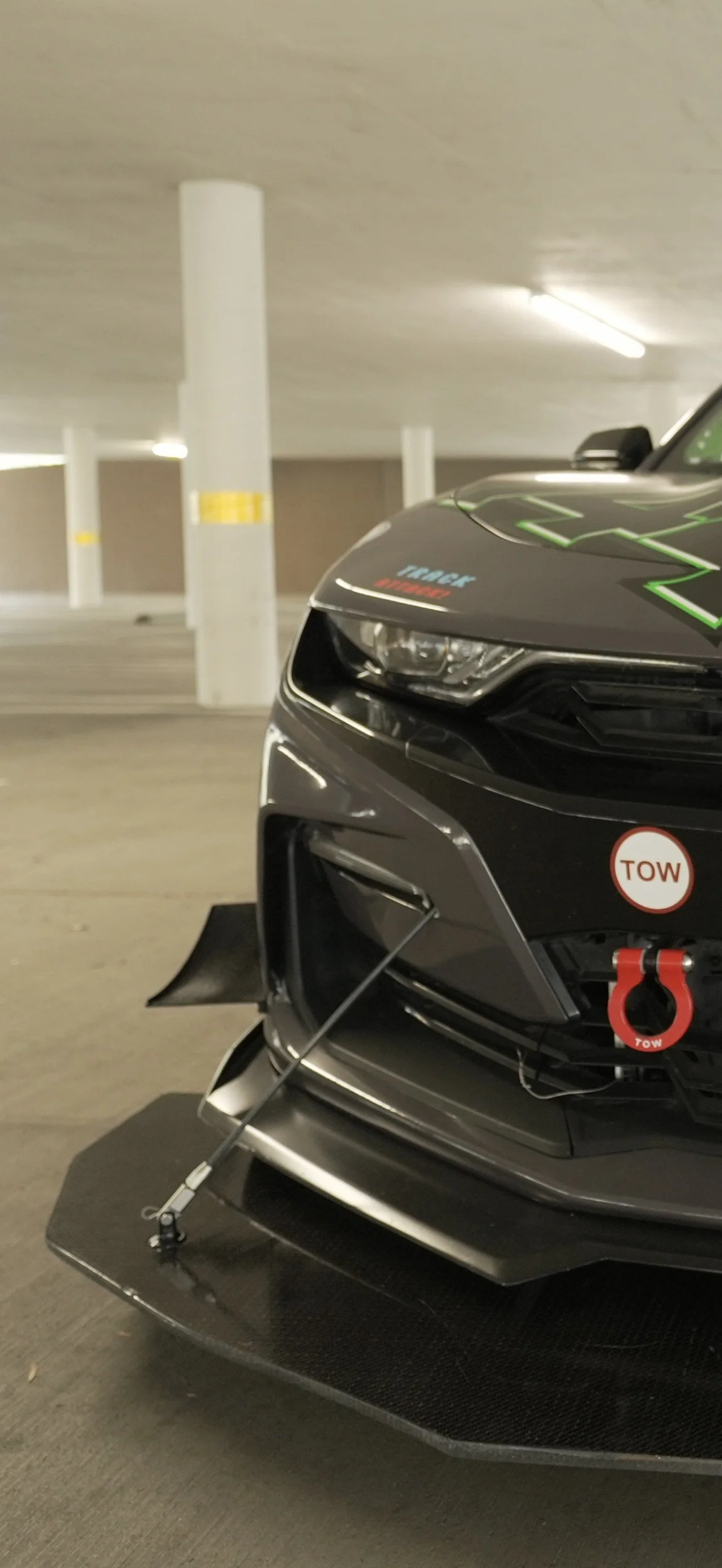Close-up of vacuum-infused carbon weave on custom splitter