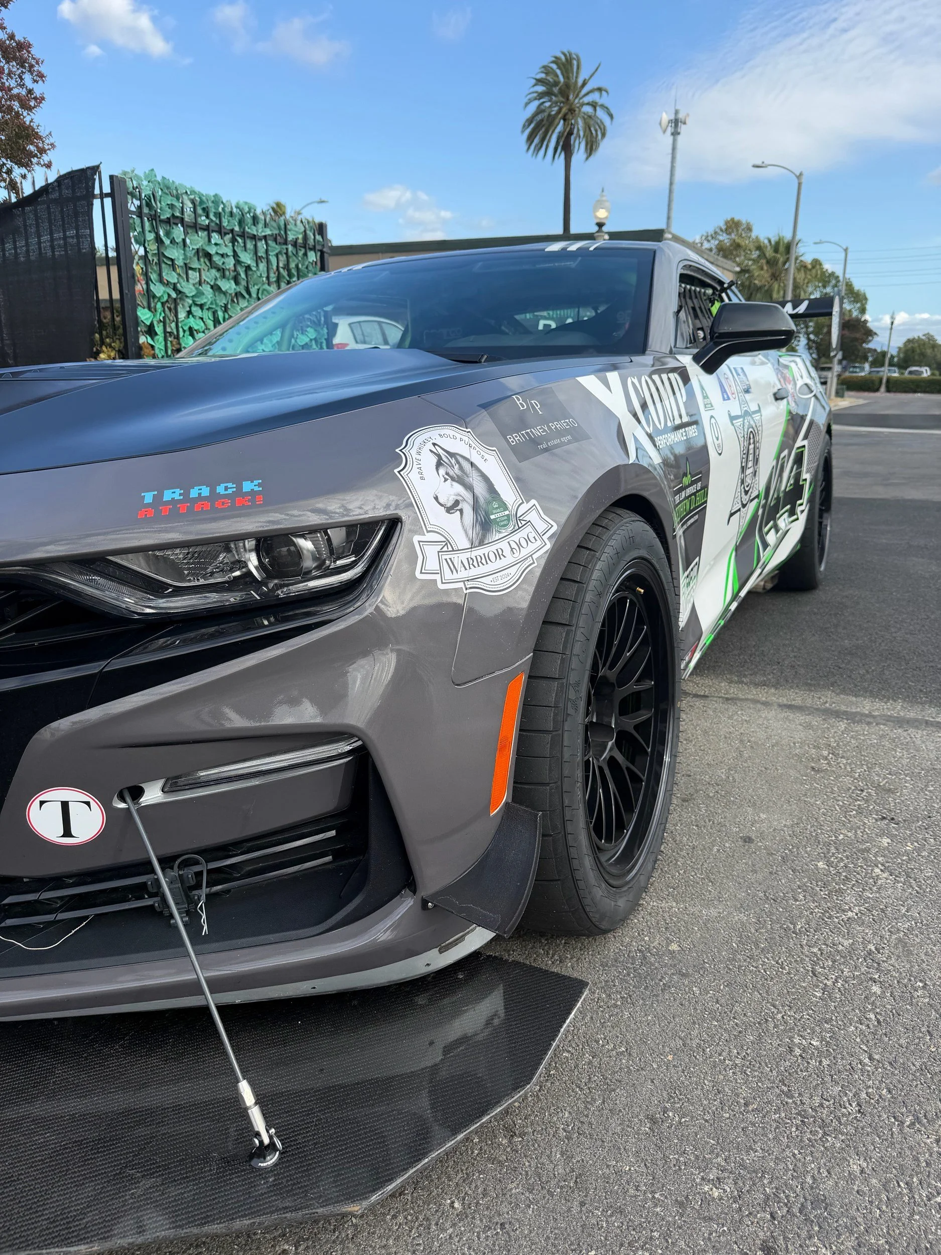 Custom carbon fiber front splitter on #144 Camaro, side profile