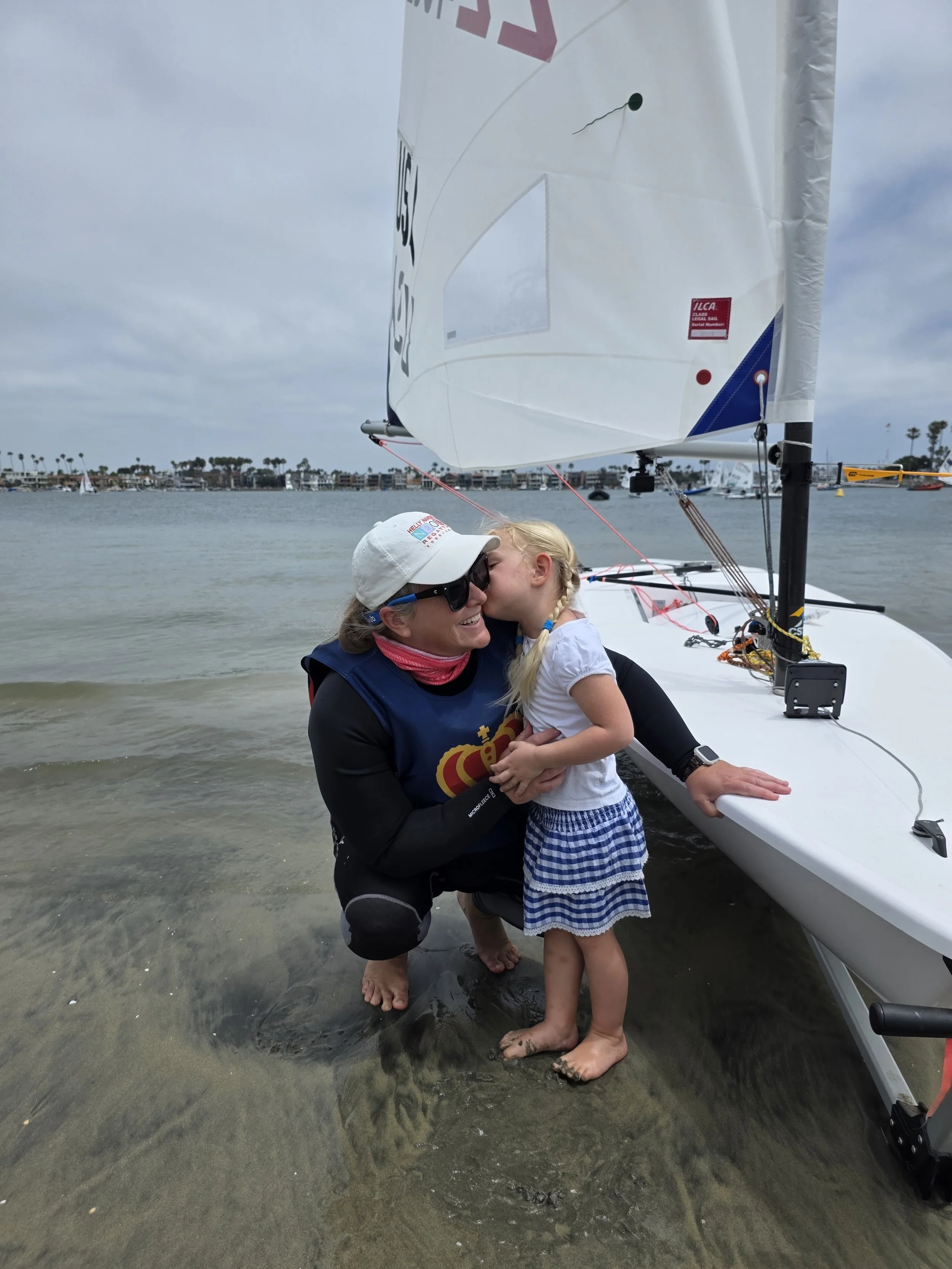 Mom of 2 Lauren Wilson gets a good luck kiss from her daughter before heading to the race course