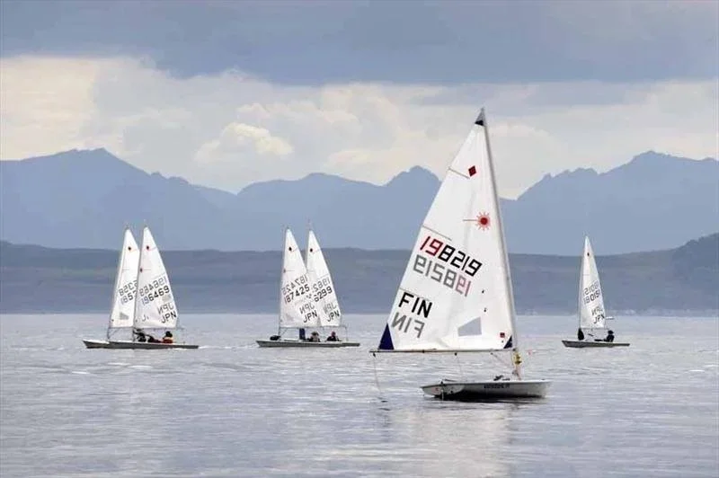 ILCA Sailboats drifting with no wind.