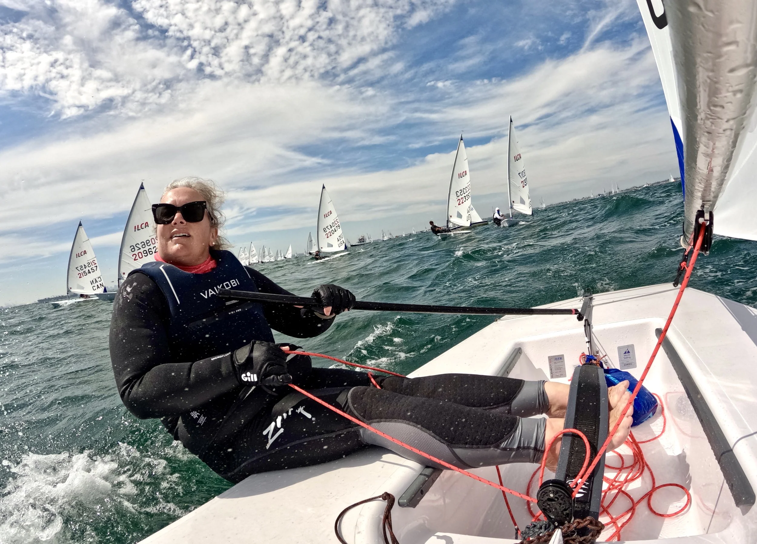 Lauren Wilson leads a fleet of ILCA 6 boats as in her feature in Latitude 38