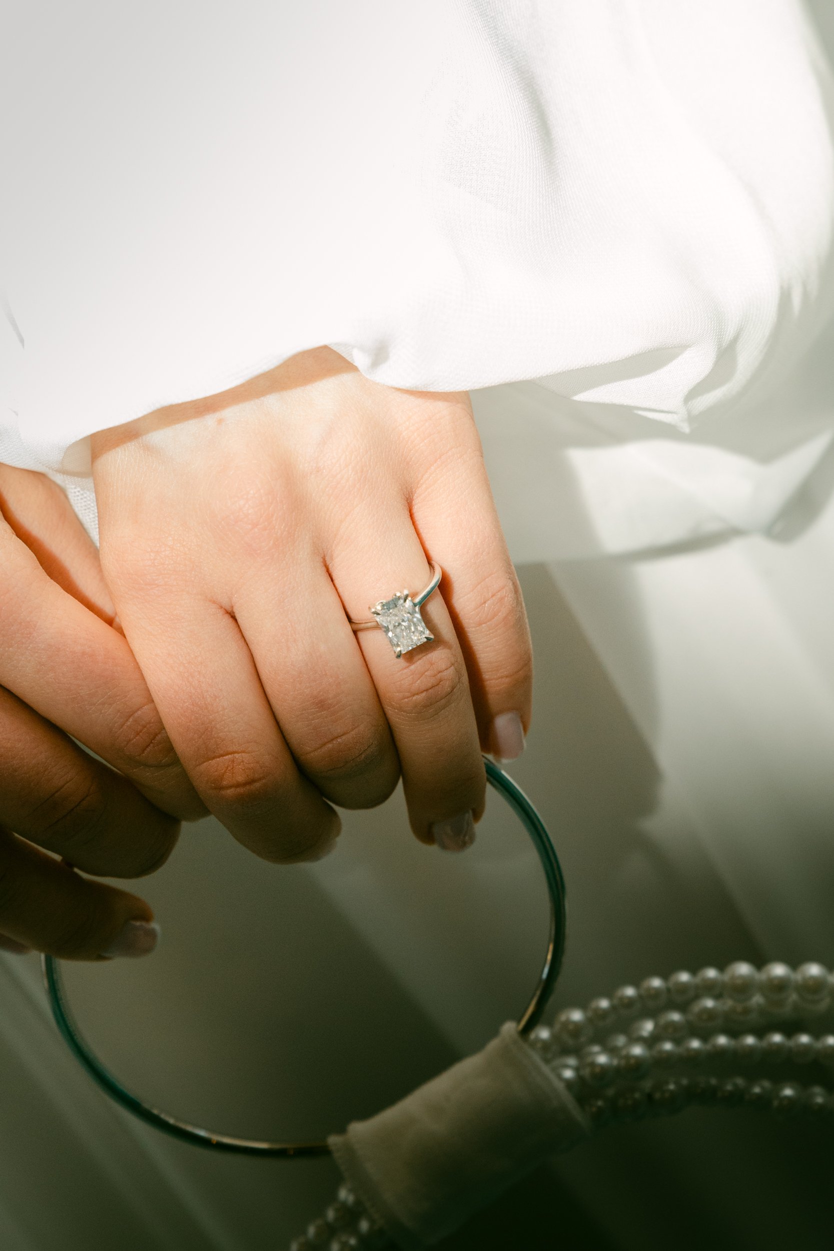 a close up of an engagement ring and handbag.JPG