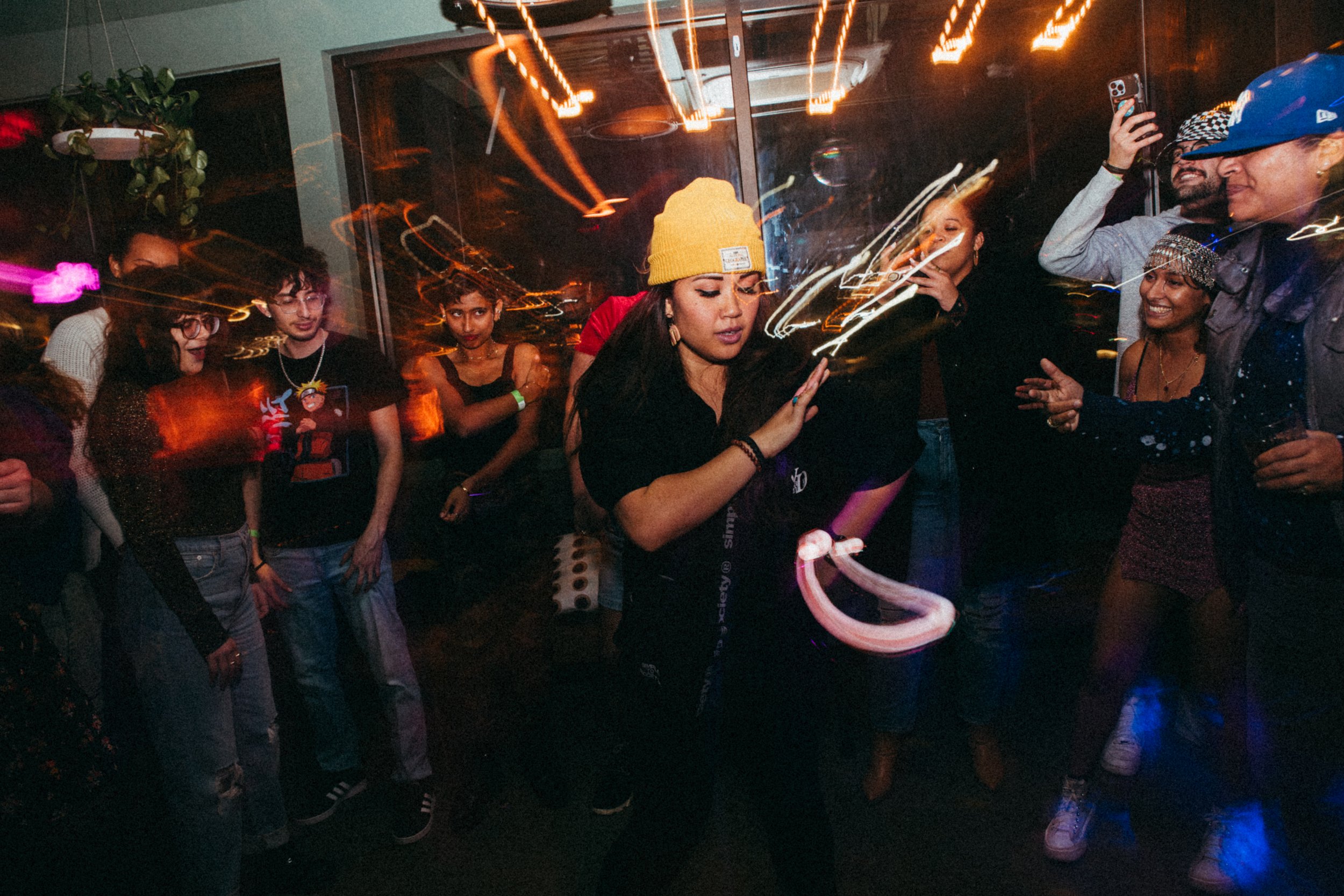 a group of onlookers while someone is dancing.jpg