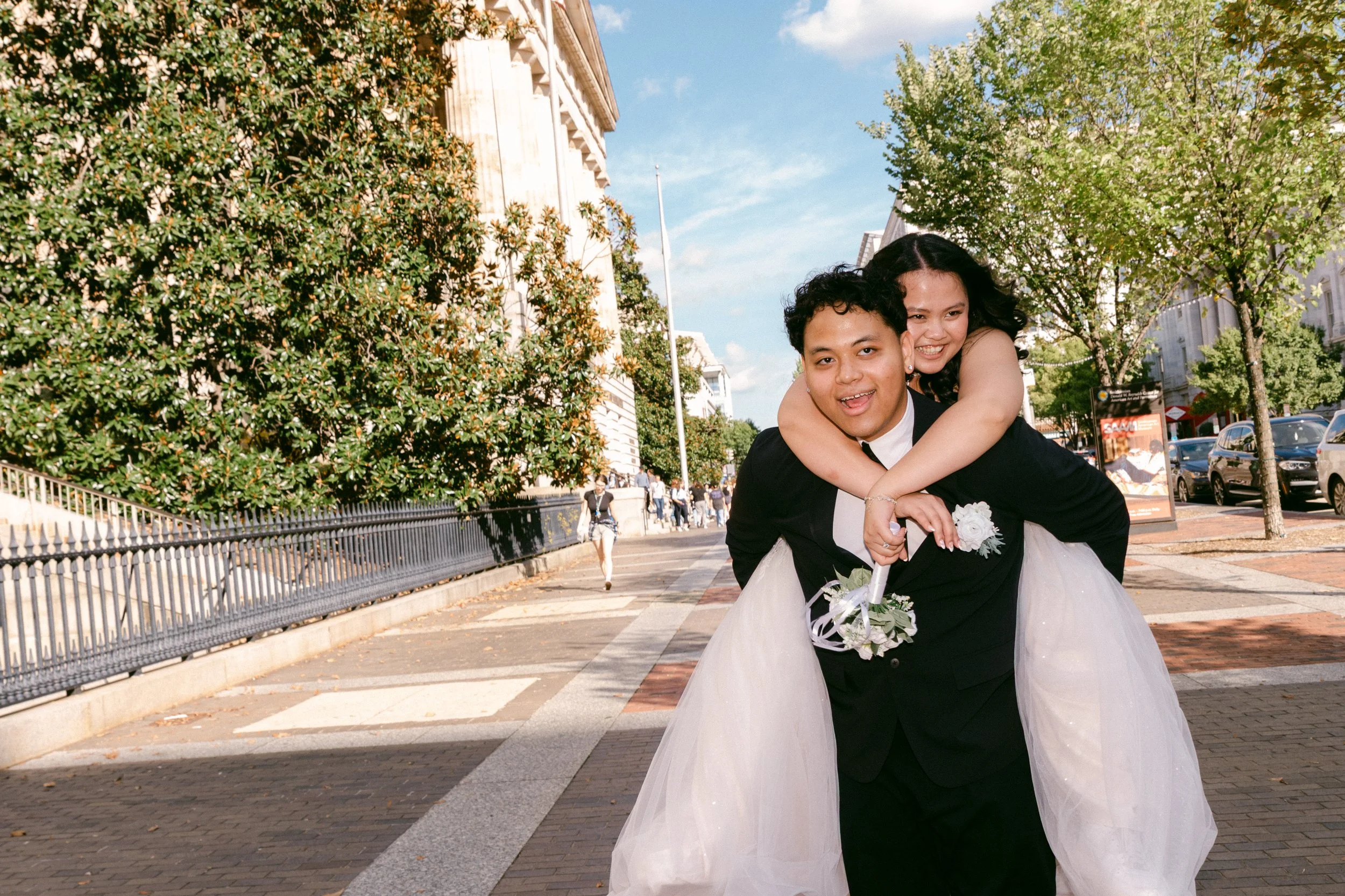 a couple piggyback riding on the street.JPG