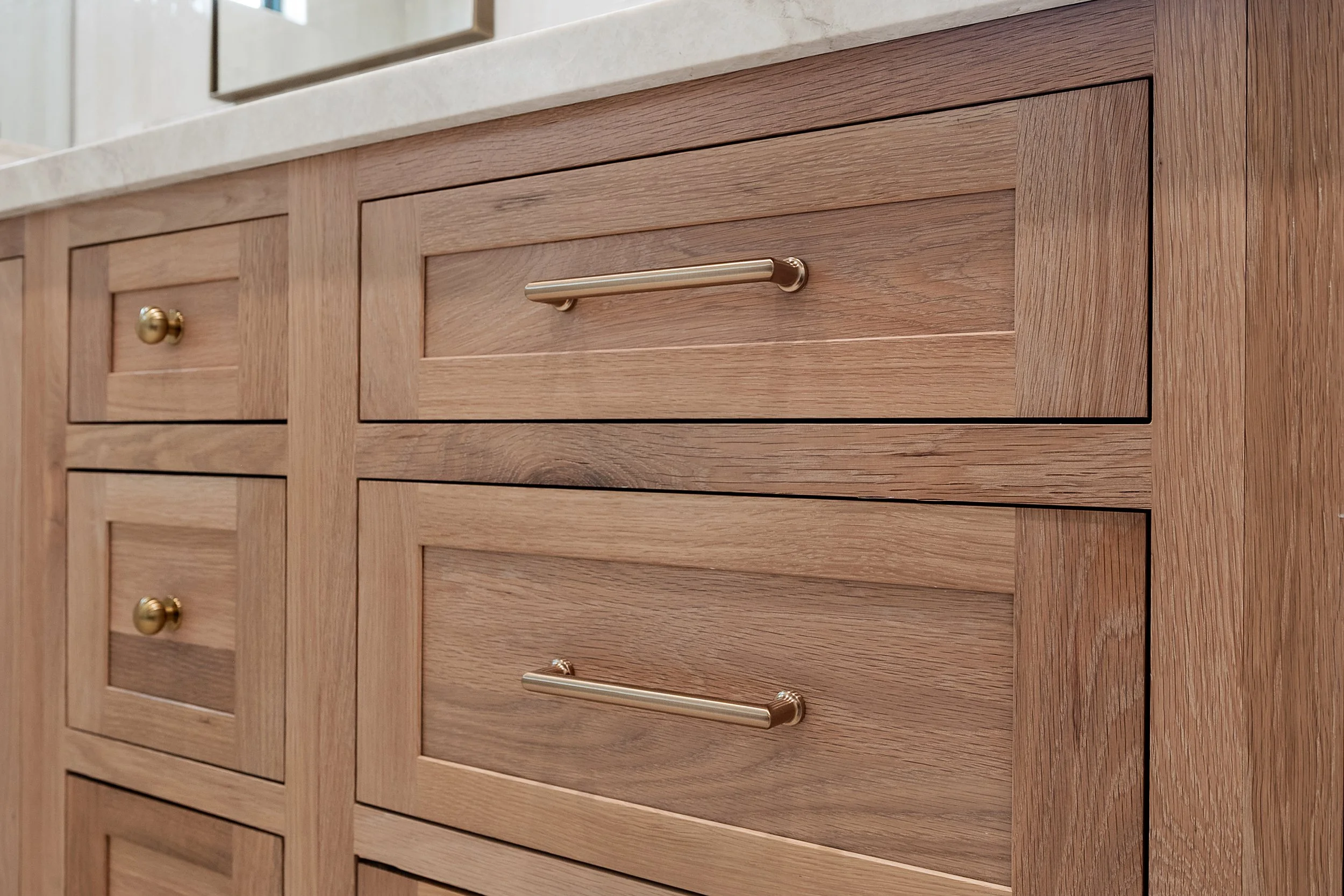 Custom inset white oak cabinetry by Shiloh Cabinetry, available through Cactus Millwork Company in Phoenix, AZ. Beautifully crafted for a timeless, furniture-style look with clean lines and refined detailing.