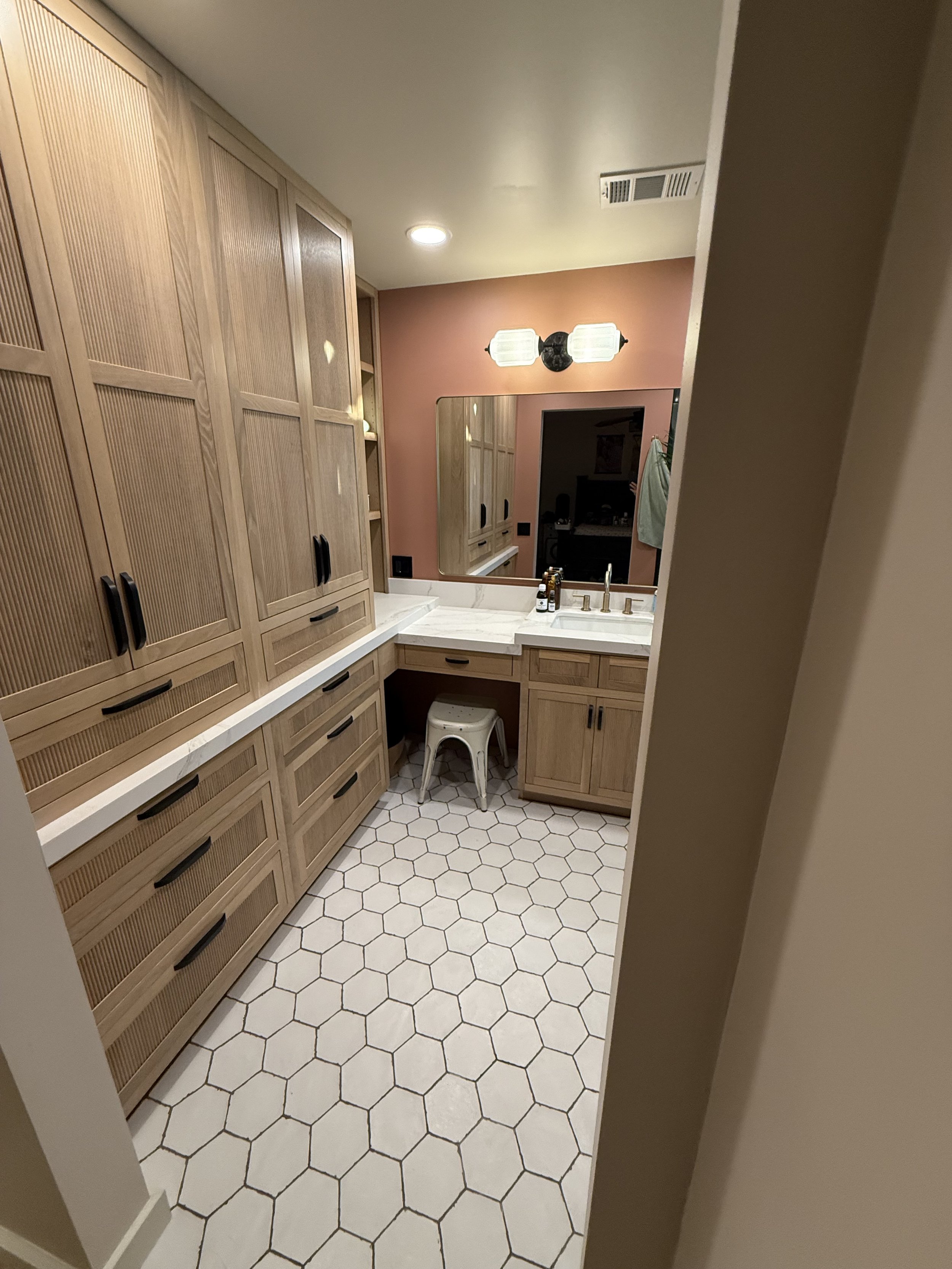 White oak, reeded inset custom cabinetry from Shiloh Cabinets