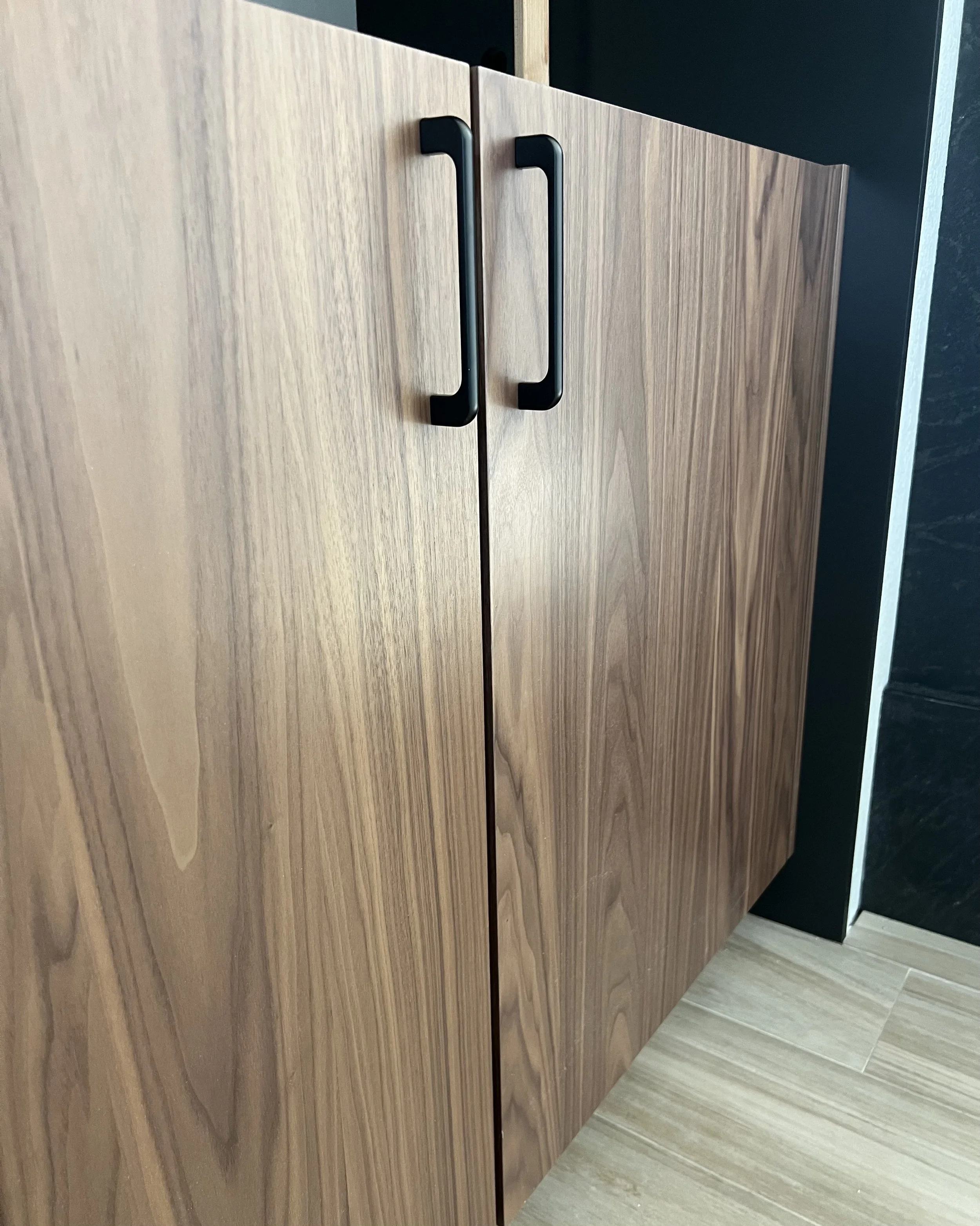 Custom walnut vanity from Eclipse Cabinetry