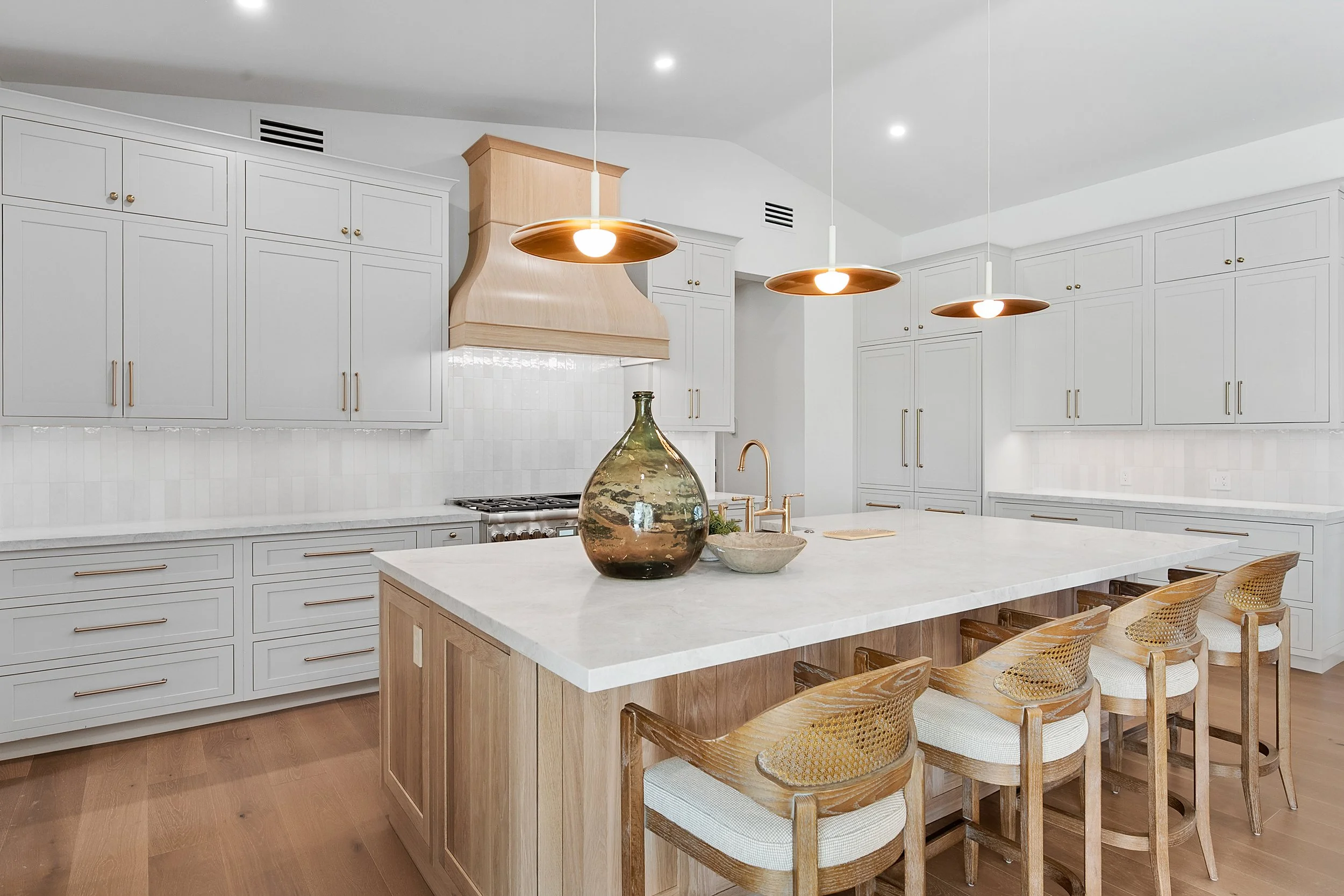 Custom inset painted cabinetry and white oak cabinetry by Shiloh Cabinetry, available through Cactus Millwork Company in Phoenix, AZ. Beautifully crafted for a timeless, furniture-style look with clean lines and refined detailing.
