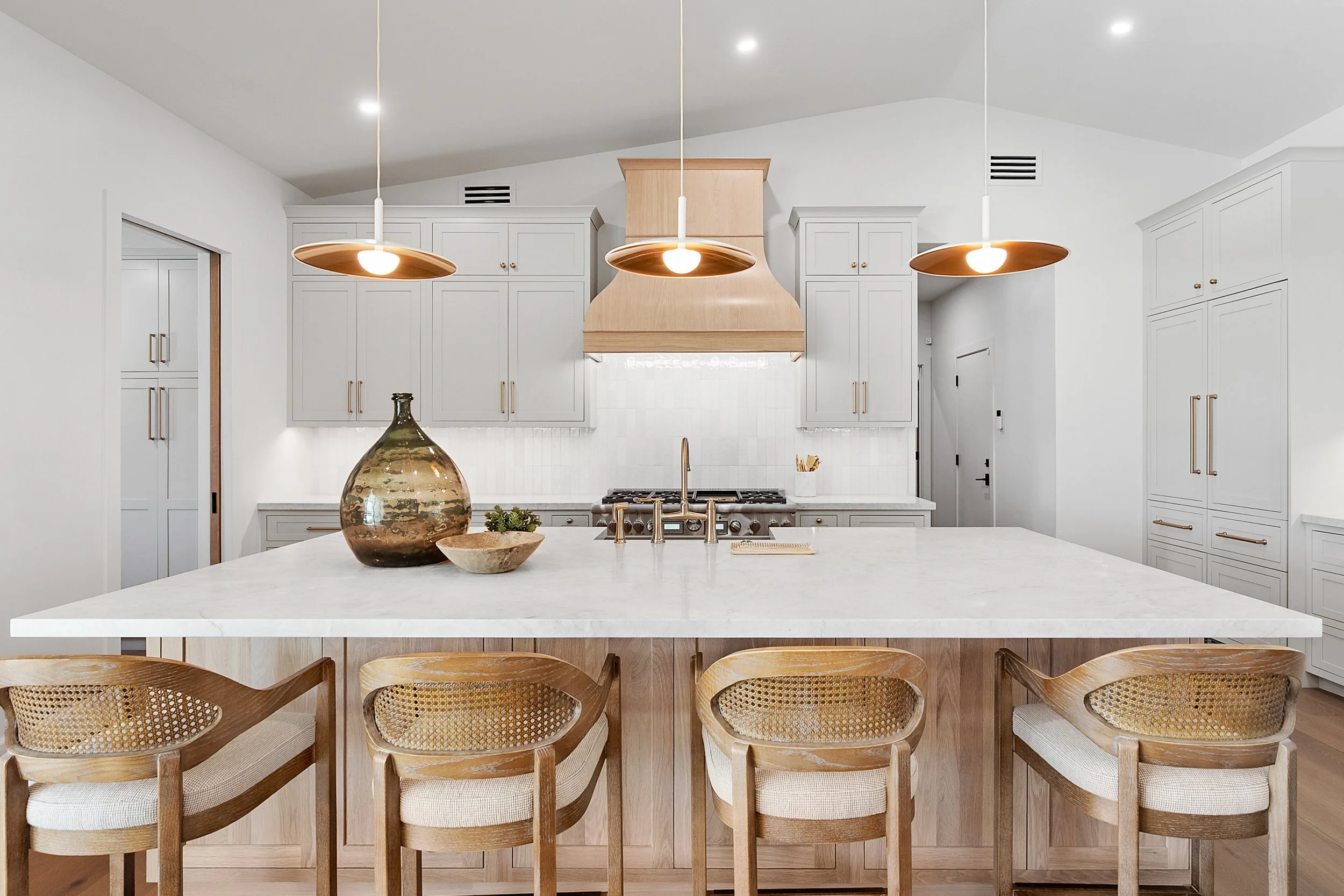 Custom inset painted cabinetry and white oak cabinetry by Shiloh Cabinetry, available through Cactus Millwork Company in Phoenix, AZ. Beautifully crafted for a timeless, furniture-style look with clean lines and refined detailing.