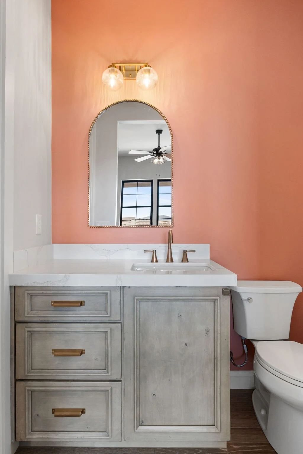 This custom vanity showcases Shiloh Custom Cabinetry crafted from knotty, high-character alder and finished in the popular “White Sands” stain. Accented with bold black hardware from Top Knobs, this design delivers a warm, rustic-modern aesthetic wit