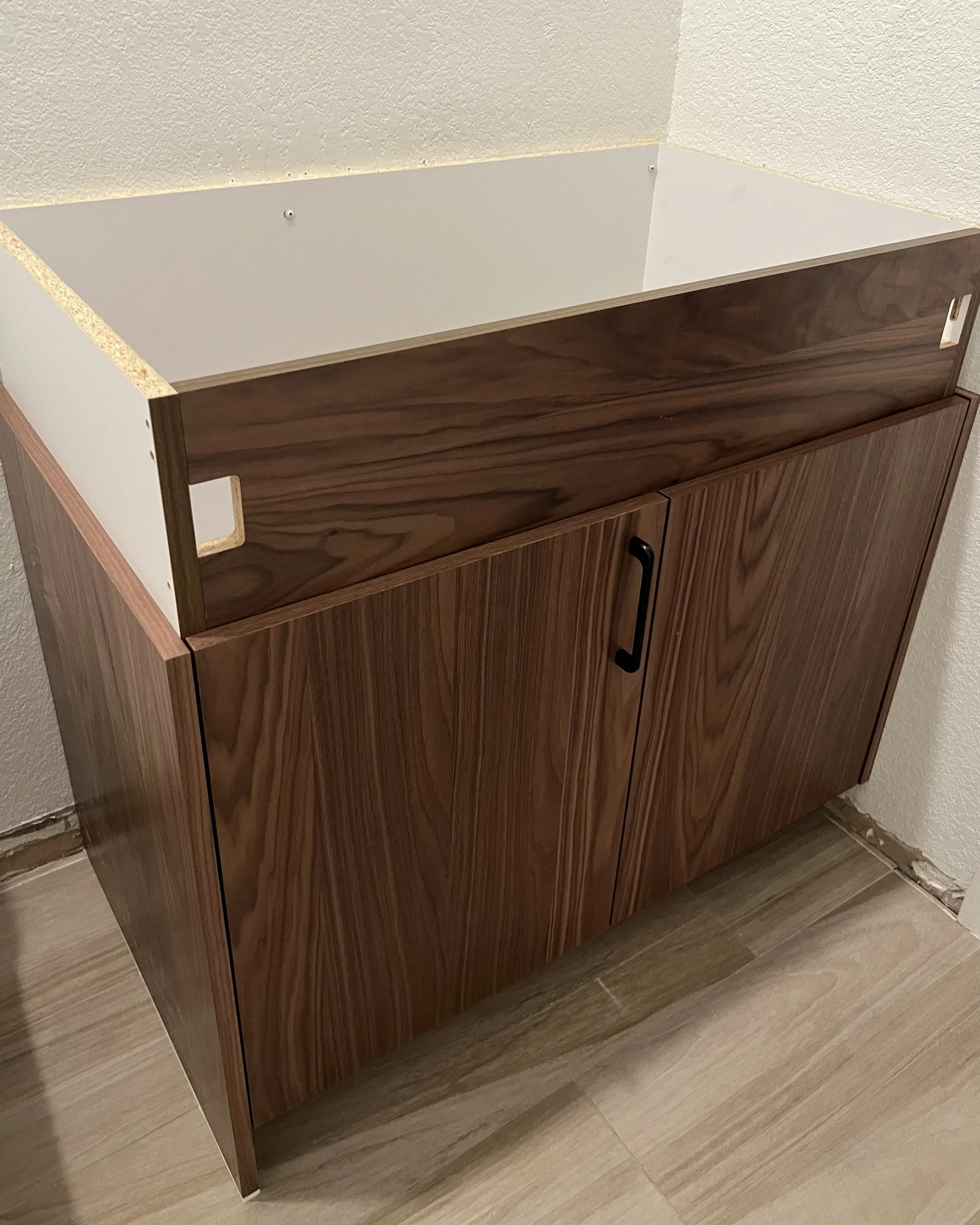 Custom walnut vanity from Eclipse Cabinetry