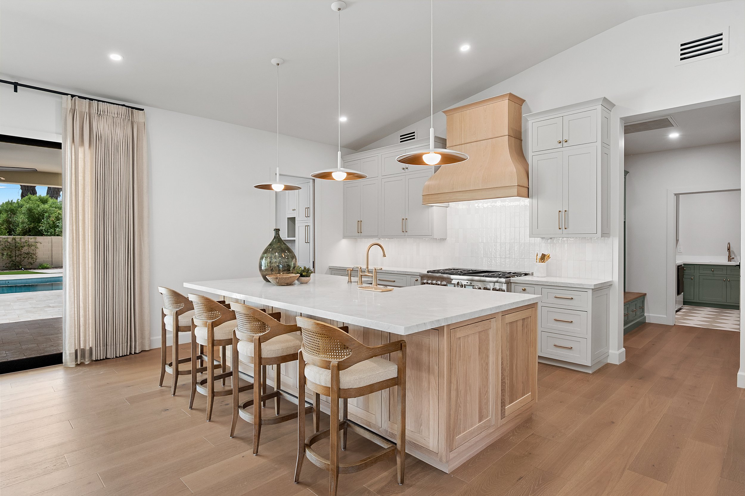 Custom inset painted cabinetry and white oak cabinetry by Shiloh Cabinetry, available through Cactus Millwork Company in Phoenix, AZ. Beautifully crafted for a timeless, furniture-style look with clean lines and refined detailing.