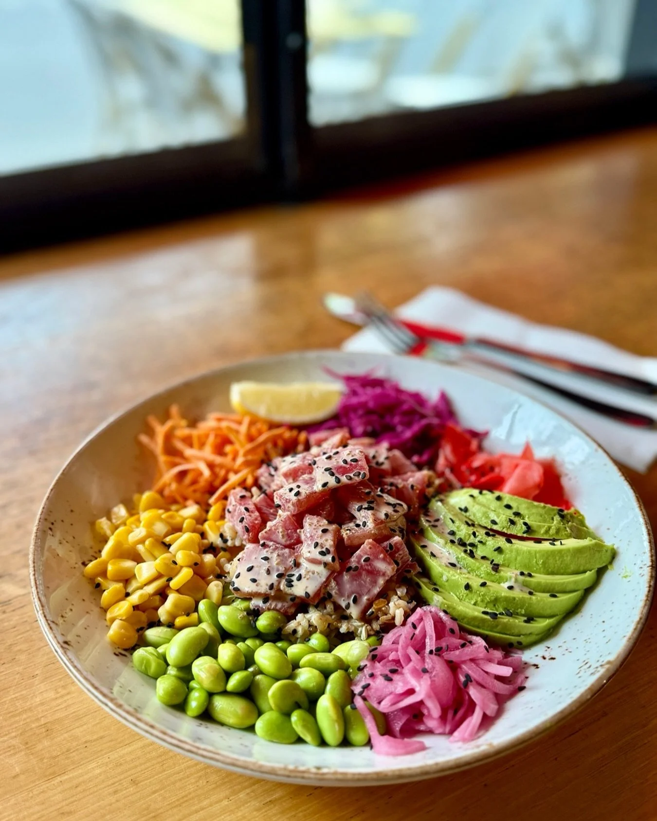 Eat the rainbow with our Summer Poke Bowl!

A firm lunch favourite, we take brown rice, edamame, sweet corn, avocado, pickled onions and carrot, then finish it all off with pickled cabbage and ginger and a drizzle of chipotle mayo.

Add fresh tuna, c