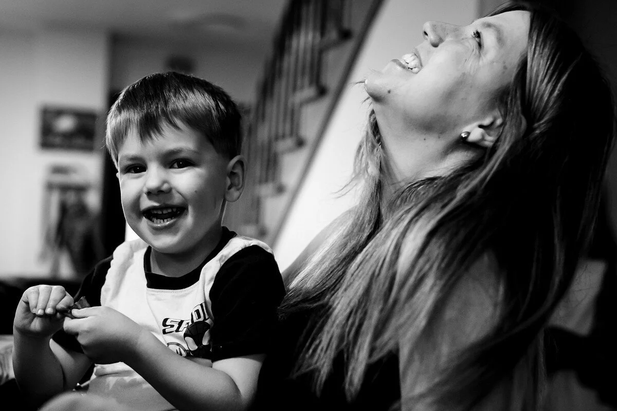Mom and son having a laugh at the breakfast table