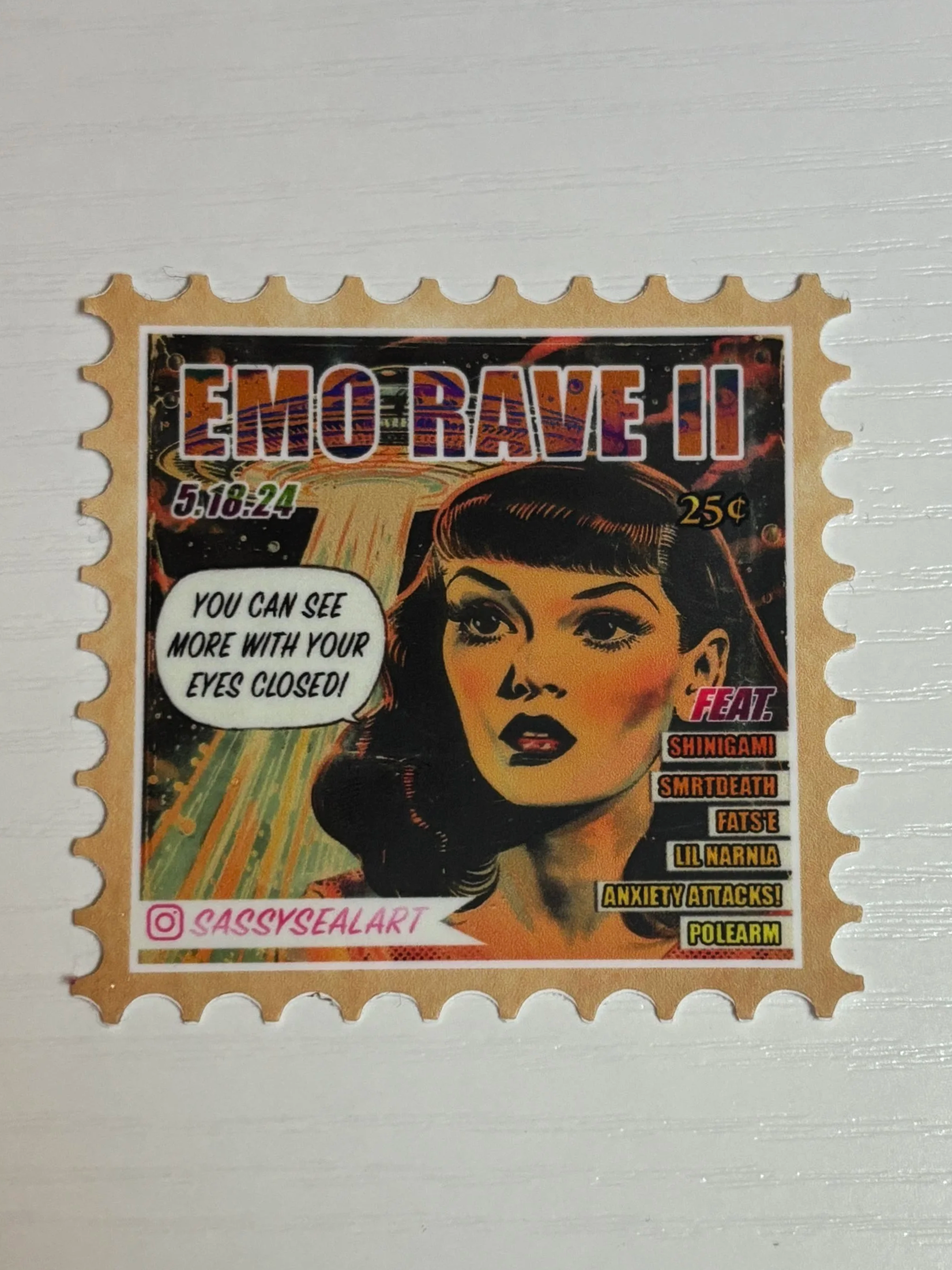 A colorful, comic book style themed postage stamp featuring a woman's face with dark hair and makeup, with the text "EMO RAVE 2" at the top and various phrases around her face, including "You can see more with your eyes closed!" and list of band name