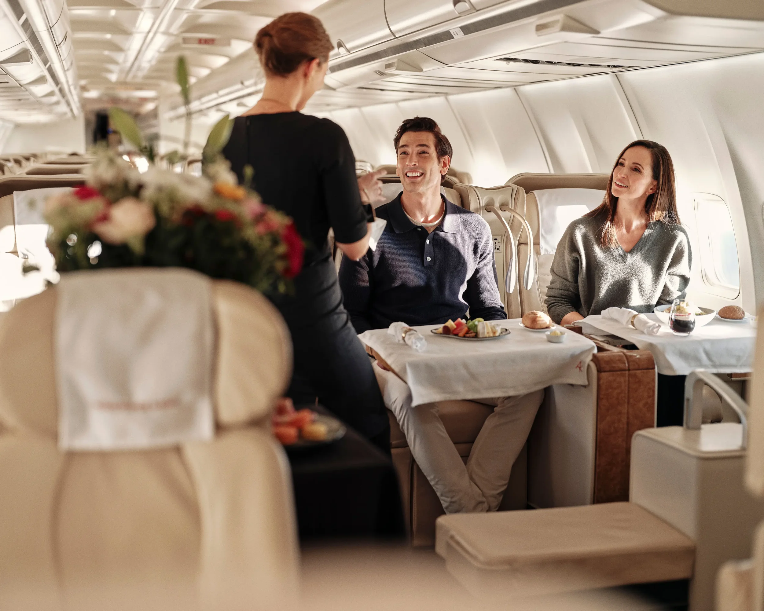 Passengers having meals served on an airplane