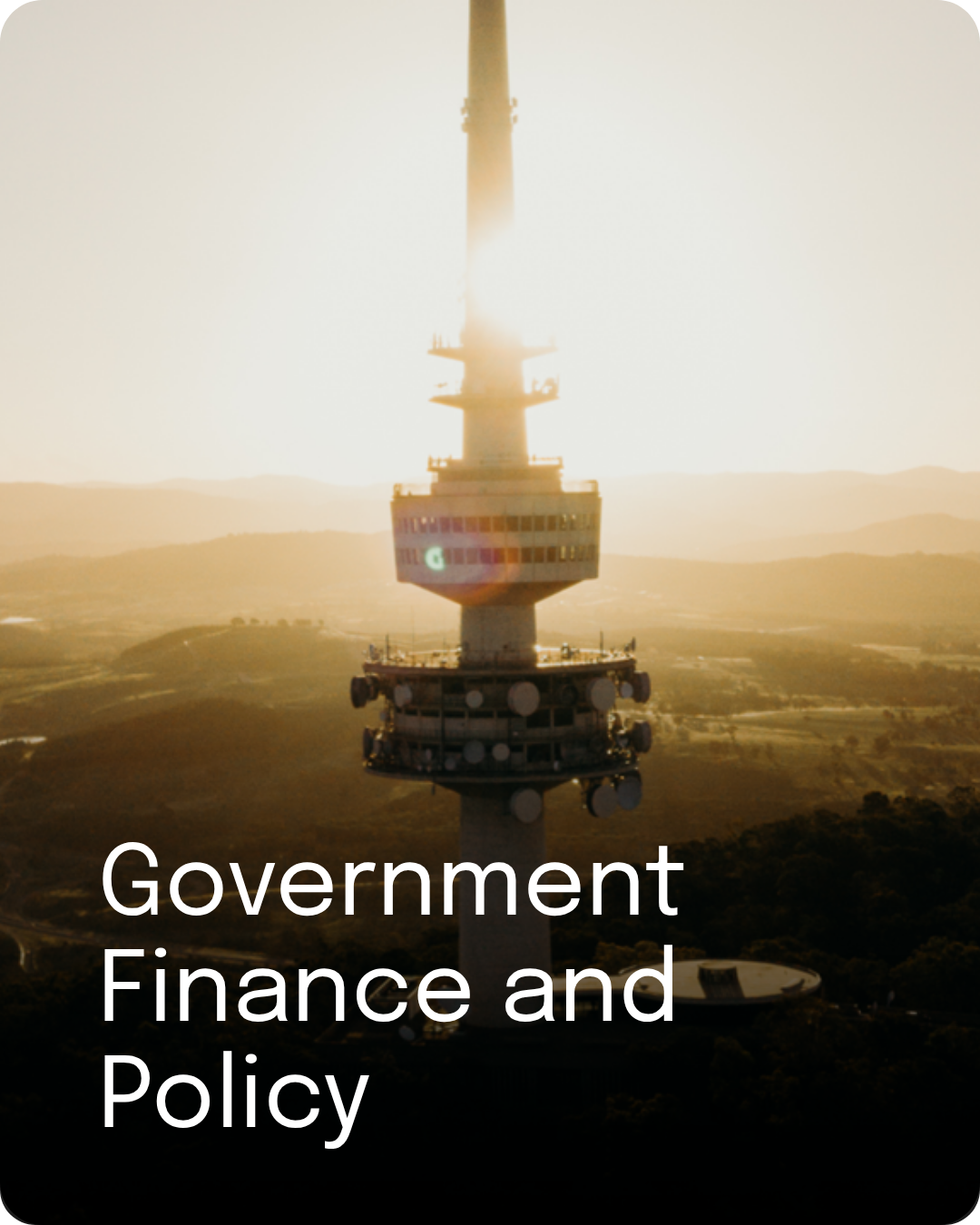 Aerial view of Telstra Tower at sunset, representing government, finance and policy work.